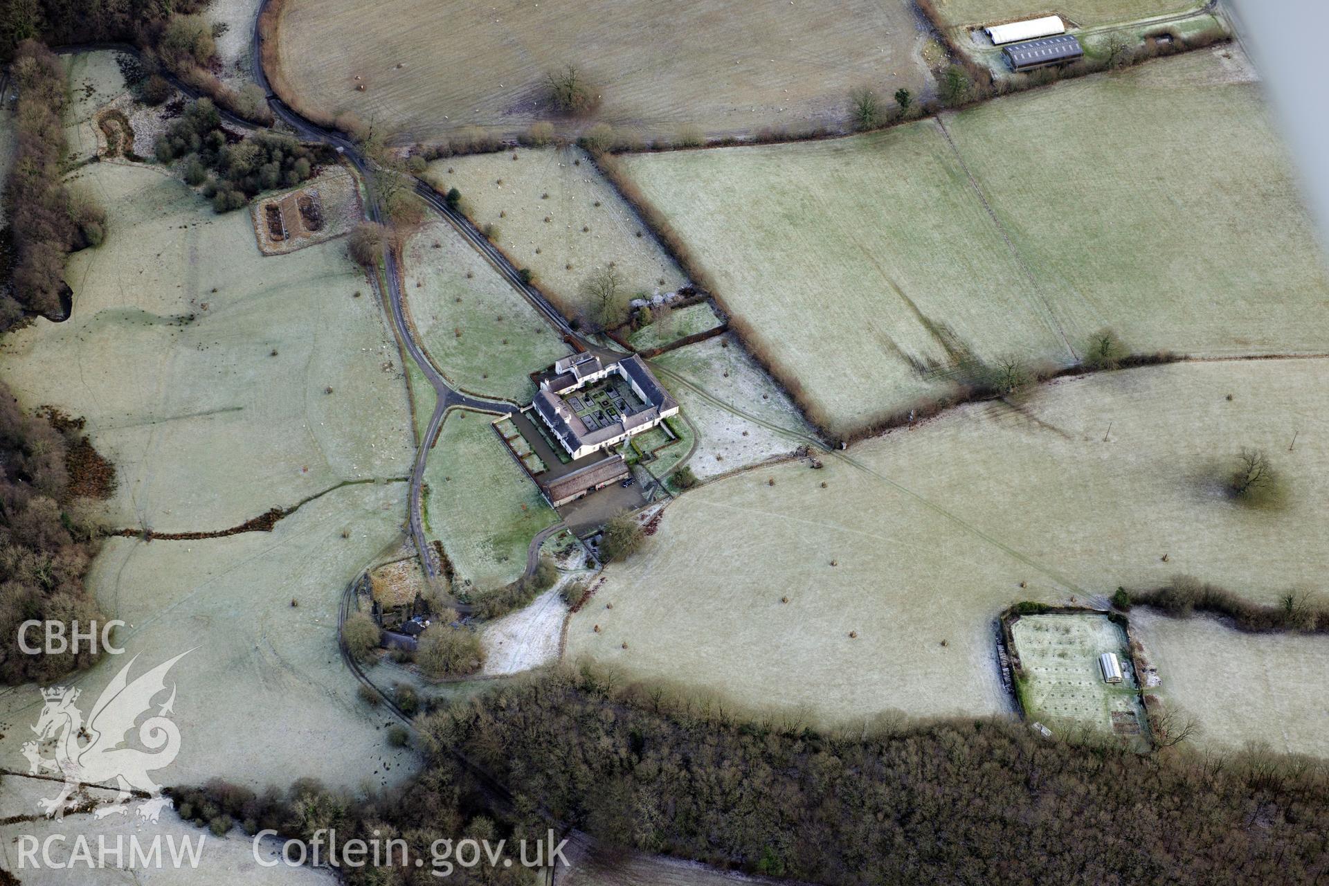 Llwynywormwood garden and farmstead, including barn, south of Llandovery. Oblique aerial photograph taken during the Royal Commission?s programme of archaeological aerial reconnaissance by Toby Driver on 15th January 2013.
