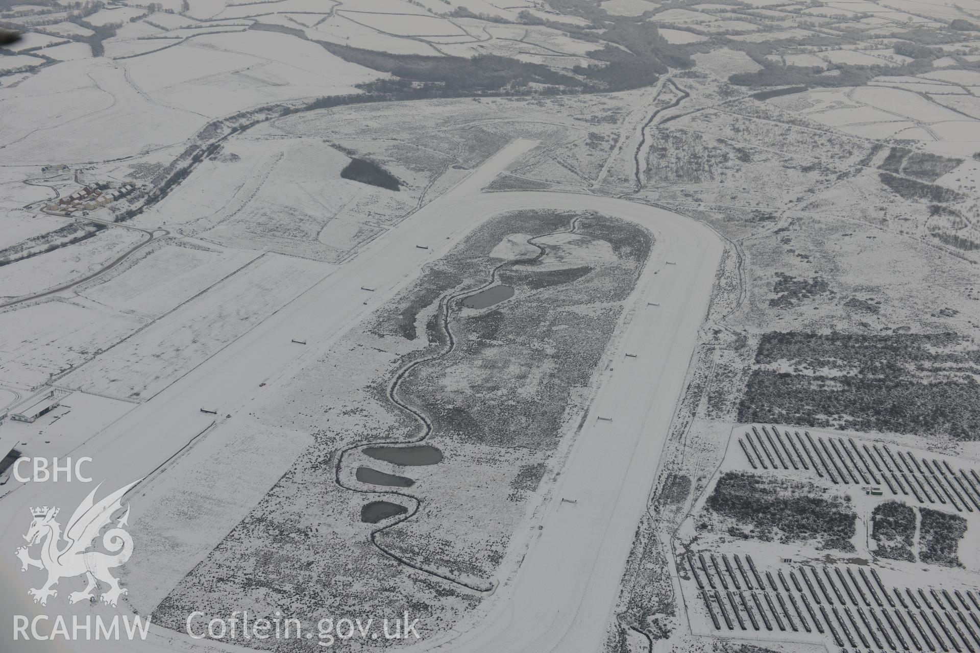 Ffos Las racecourse and Ffos Las solar farm, Trimsaran, north west of Llanelli. Oblique aerial photograph taken during the Royal Commission?s programme of archaeological aerial reconnaissance by Toby Driver on 24th January 2013.