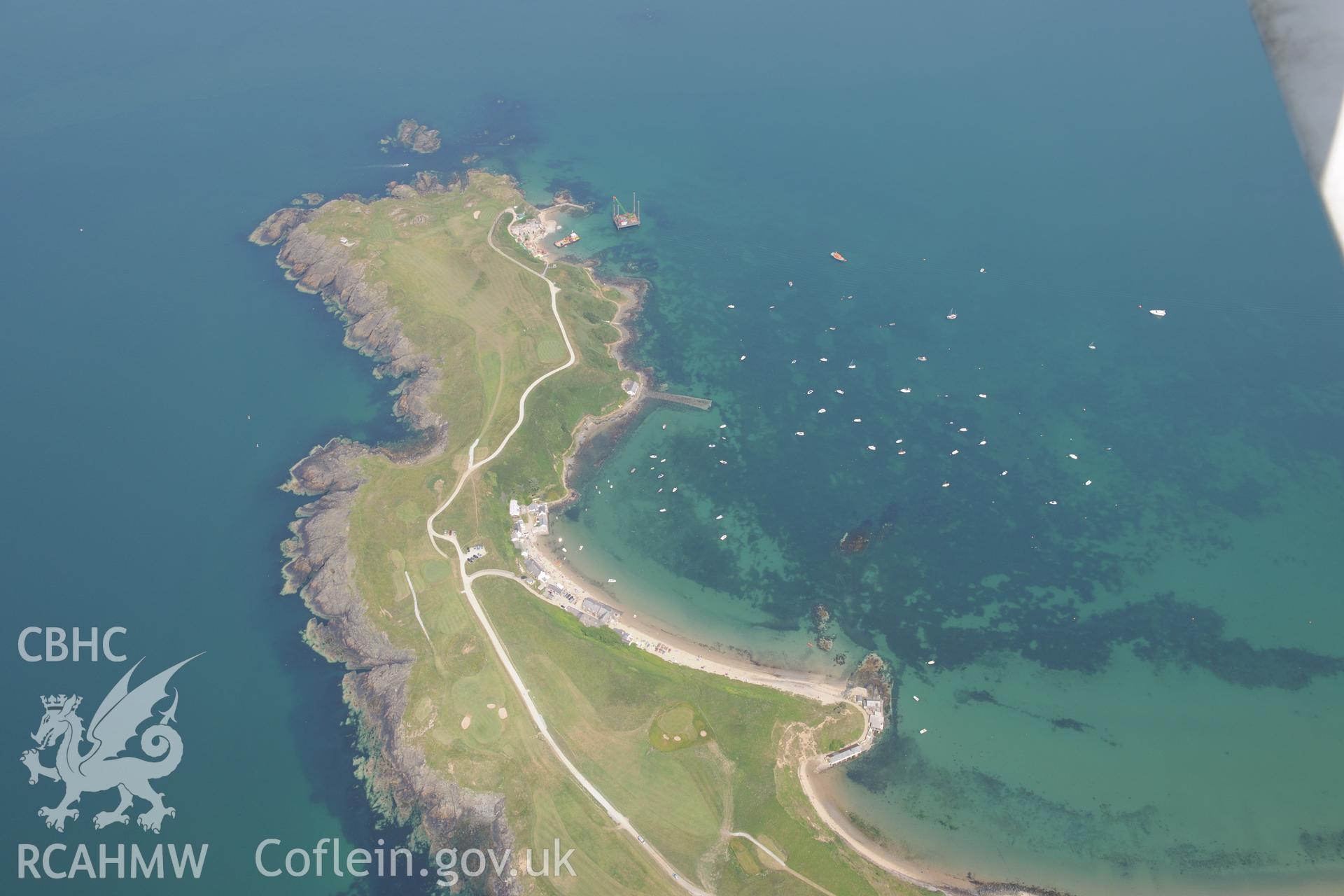 Lifeboat House, Lighthouse, Old Pier, Trwyn Porth Dinllaen Promontory Enclosure and Porth Dinllaen village. Oblique aerial photograph taken during the Royal Commission?s programme of archaeological aerial reconnaissance by Toby Driver on 12th July 2013.