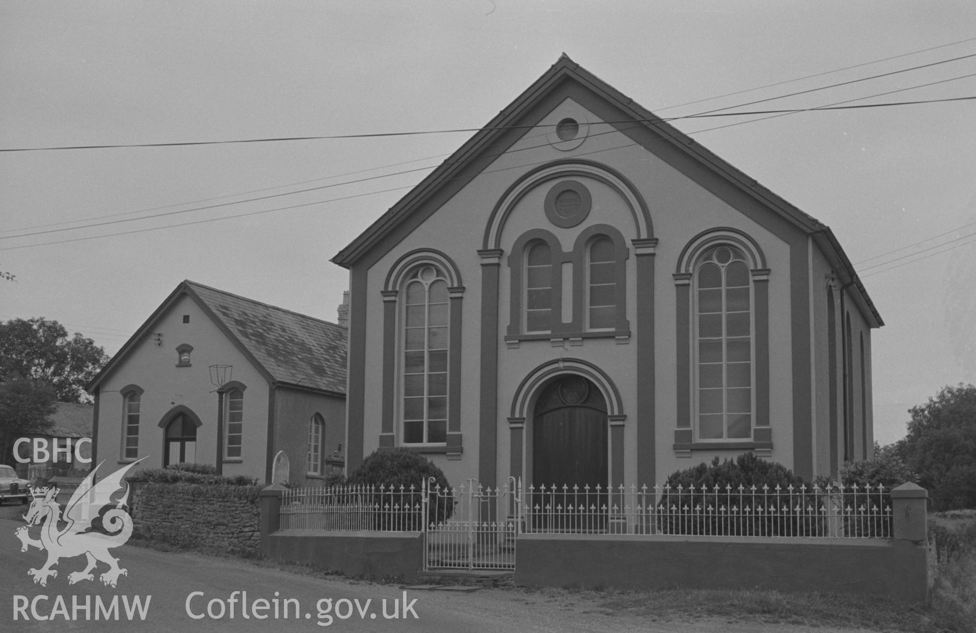 Digital copy of black & white negative showing Bryngwyn Independent Chapel and school house at crossroads 1.7km south east of Beulah. Photographed by Arthur O. Chater on 7th September 1966 looking north north east from Grid Reference SN 300 449.