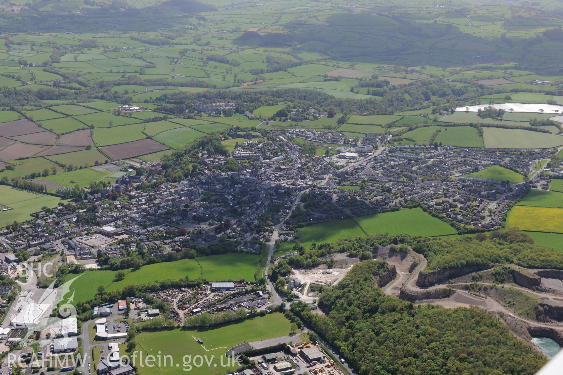 Denbigh, with quarry on its northern outskirts. Oblique aerial photograph taken during the Royal Commission?s programme of archaeological aerial reconnaissance by Toby Driver on 22nd May 2013.