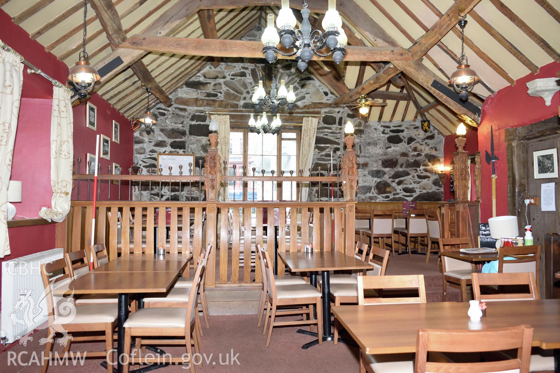 Colour photograph showing view looking east at the first floor restaurant area of Y Sospan, Llys Owain, Dolgellau. Photographed by I. P. Brookes of Engineering Archaeological Services, June 2019.