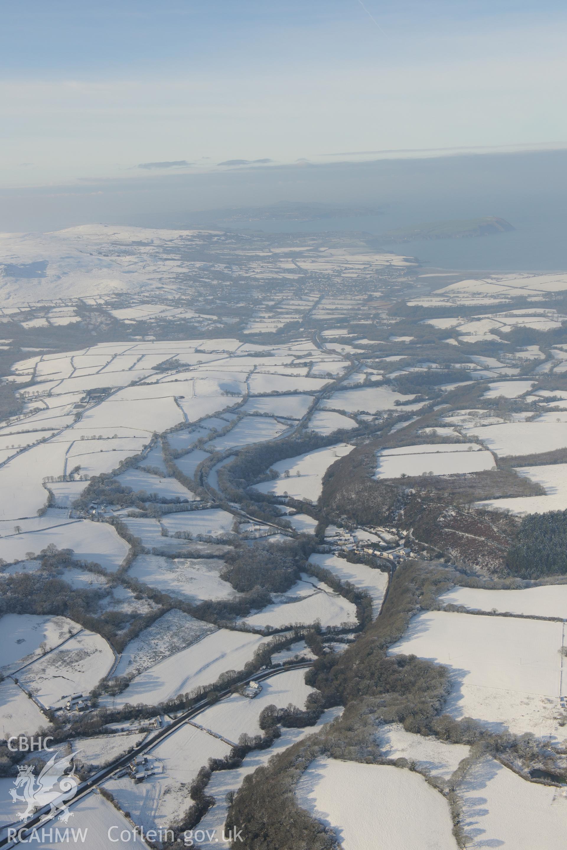 Felindre Farchog, south west of Cardigan. Oblique aerial photograph taken during the Royal Commission?s programme of archaeological aerial reconnaissance by Toby Driver on 24th January 2013.