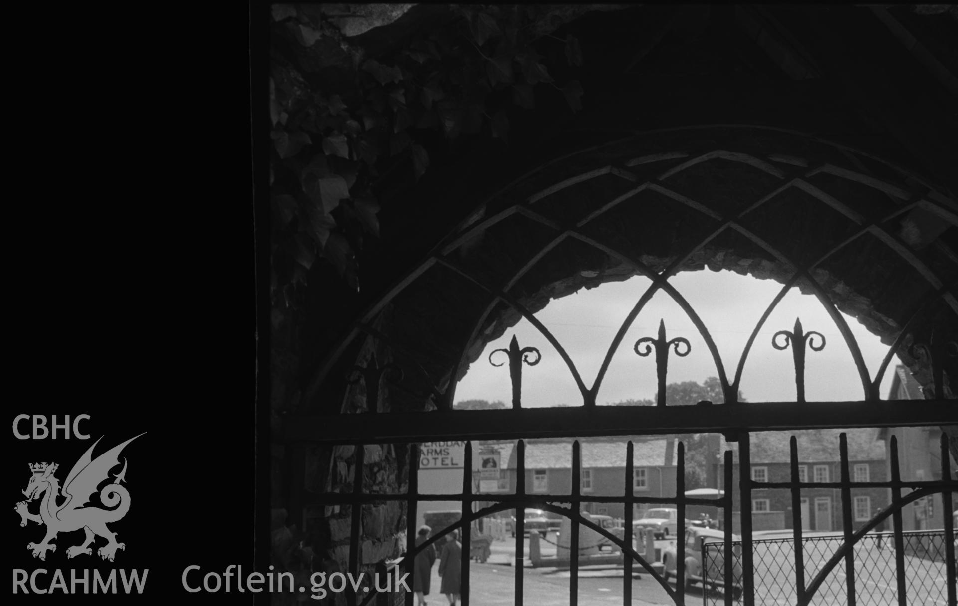 Digital copy of a black and white negative showing 1814 ironwork of east lychgate in St. Padarn's churchyard, Llanbadarn, Aberystwyth. (View looking west from Grid Reference SN 590 809). Photographed by Arthur O. Chater in August 1967.