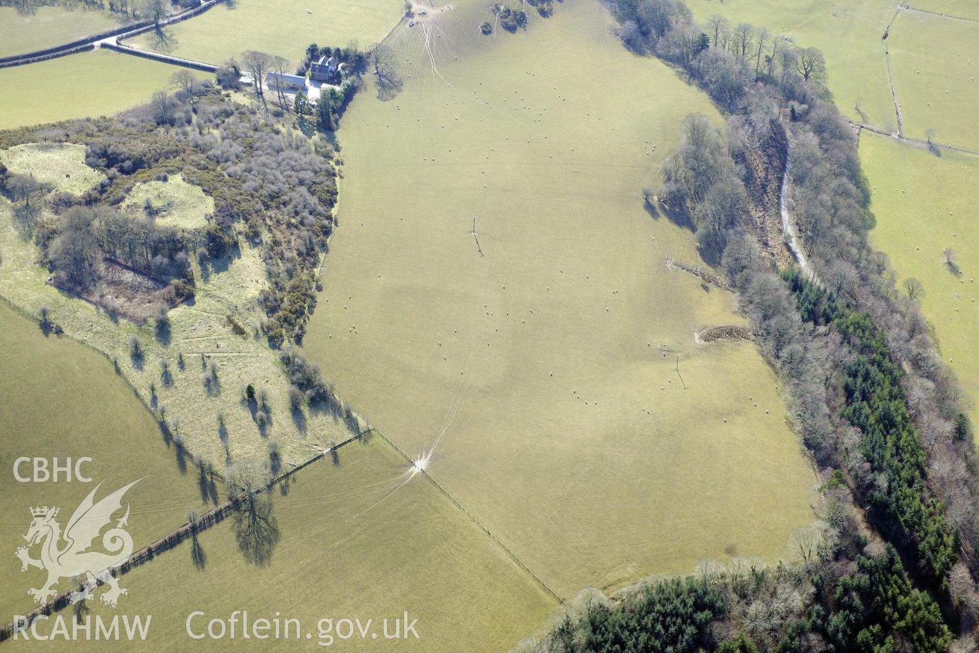 Pen-y-Castell hillfort and a defended enclosure to its north, Llanilar, south east of Aberystwyth. Oblique aerial photograph taken during the Royal Commission's programme of archaeological aerial reconnaissance by Toby Driver on 2nd April 2013.