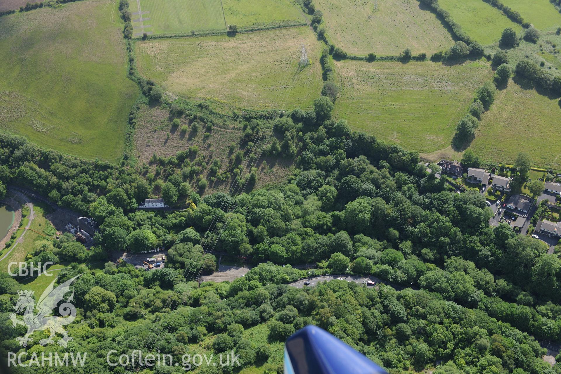 Site of stone quarries at Furnace, on the northern outskirts of Llanelli. Oblique aerial photograph taken during the Royal Commission's programme of archaeological aerial reconnaissance by Toby Driver on 19th June 2015.