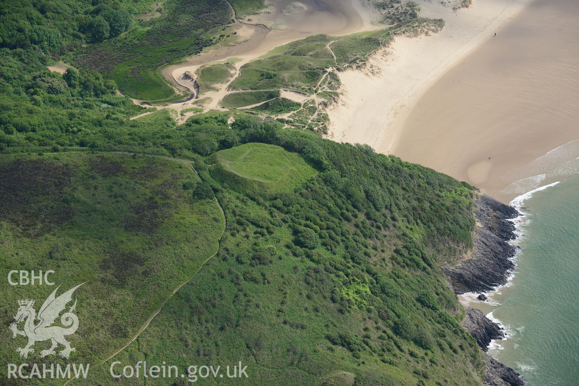 Castle Tower, Penmaen. Oblique aerial photograph taken during the Royal Commission's programme of archaeological aerial reconnaissance by Toby Driver on 19th June 2015.