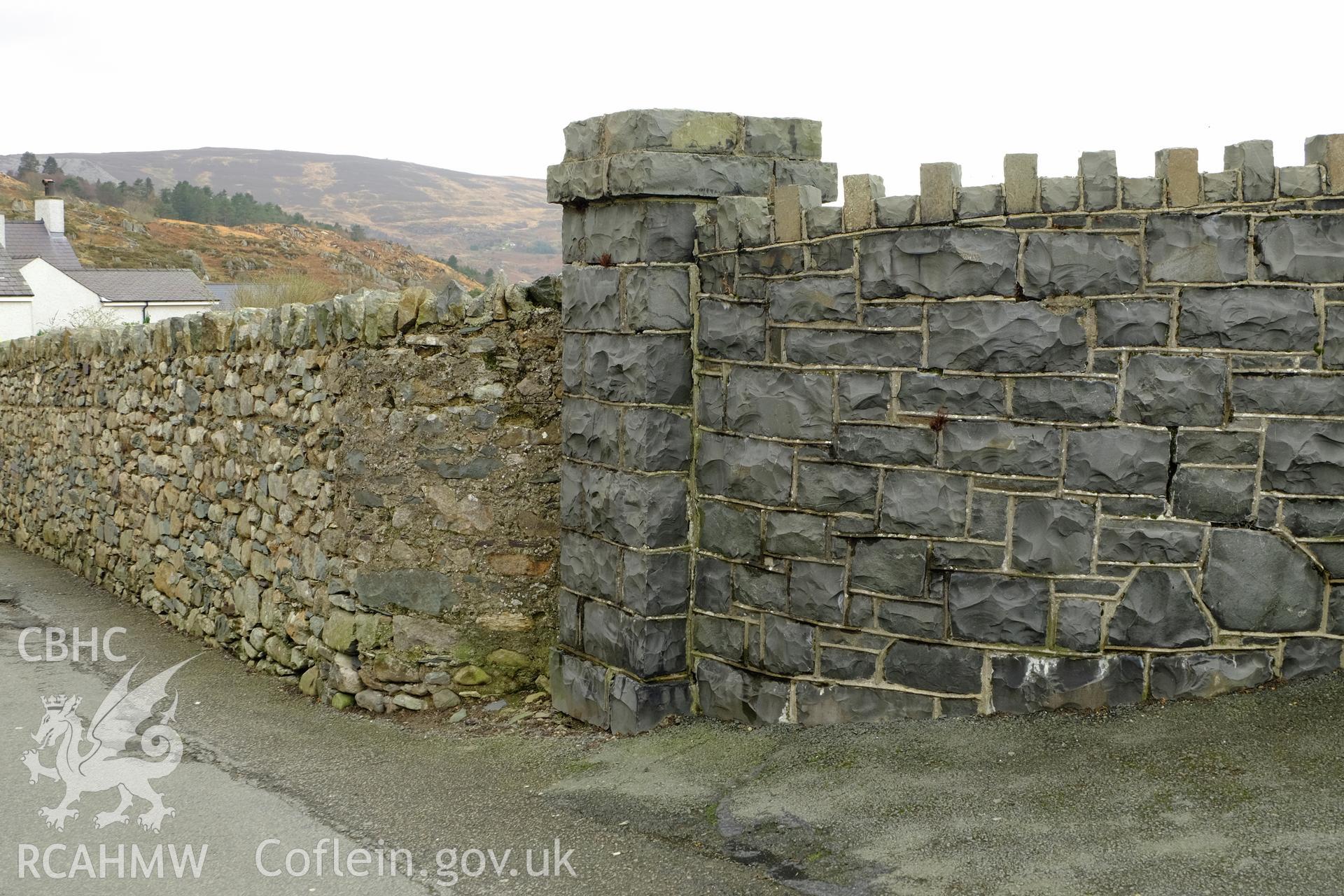 Colour photograph showing view of the boundary wall to Ffordd Deiniol at Macpela Cemetery, Deiniolen, produced by Richard Hayman 2nd February 2017