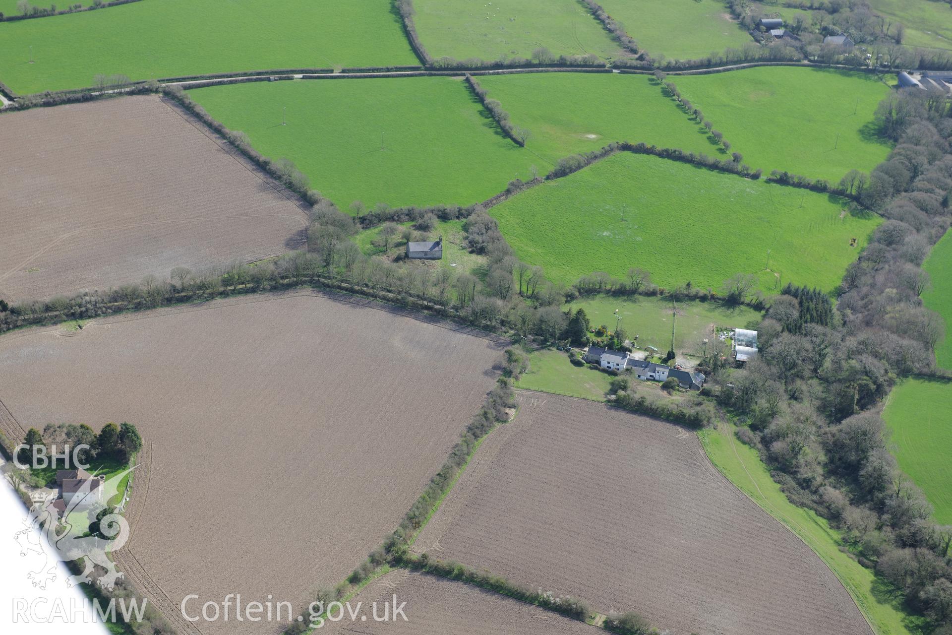 St Andrew's Church, Bayvil. Oblique aerial photograph taken during the Royal Commission's programme of archaeological aerial reconnaissance by Toby Driver on 15th April 2015.