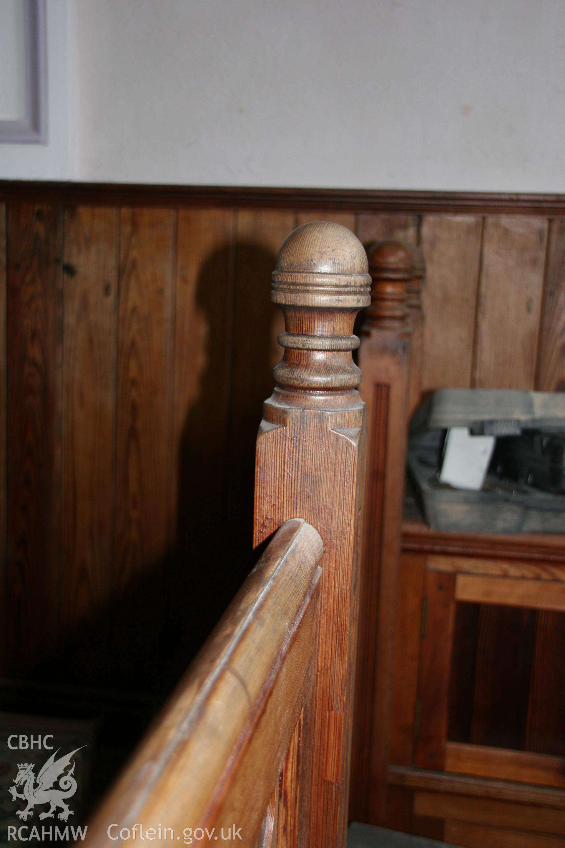Photograph showing detailed view of wooden pew and panelling at the former Llawrybettws Welsh Calvinistic Methodist chapel, Glanyrafon, Corwen. Produced by Tim Allen on 7th March 2019 to meet a condition attached to planning application.