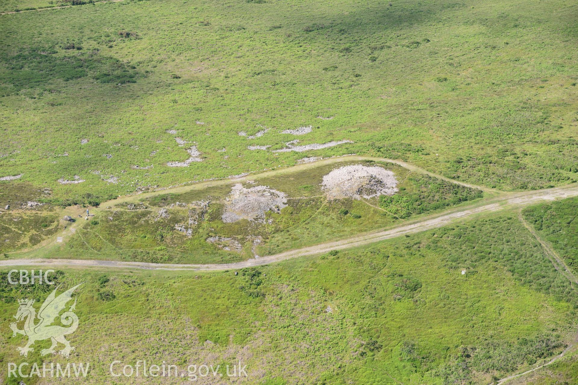 Cairns  and Beacon II on Cefn Bryn. Oblique aerial photograph taken during the Royal Commission's programme of archaeological aerial reconnaissance by Toby Driver on 19th June 2015.