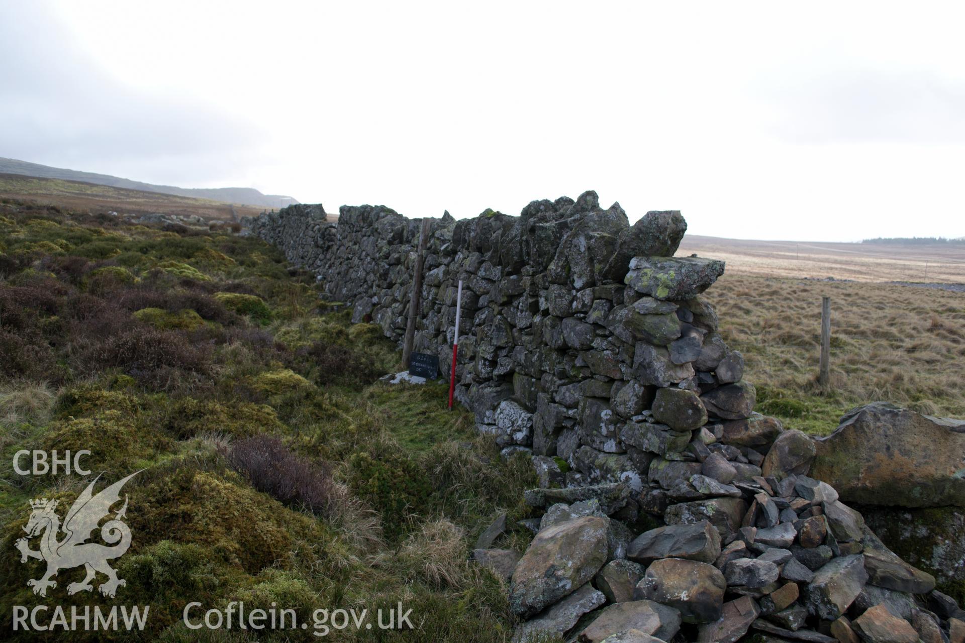 View from the north east 'of drystone wall 01.' Photographed by Gwynedd Archaeological Trust as part of walkover survey of Penrhyn Quarry, Bethesda, on 20th February 2018. Project no. G2556.