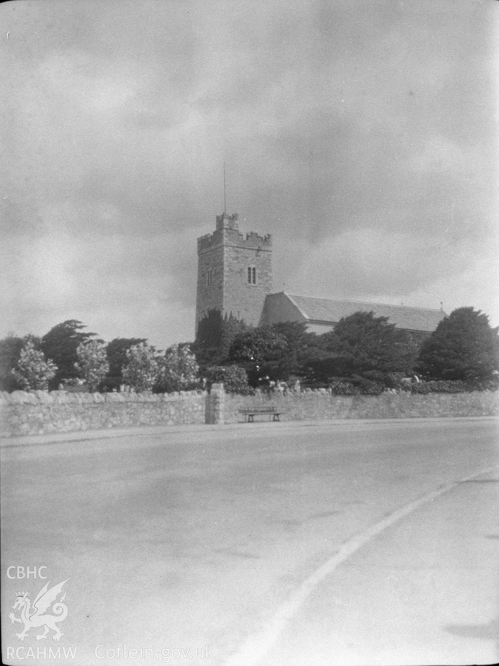 Digital copy of a nitrate negative showing exterior view of St Trillo's Church, Llandrillo yn Rhos, taken from across the road. From the National Building Record Postcard Collection.