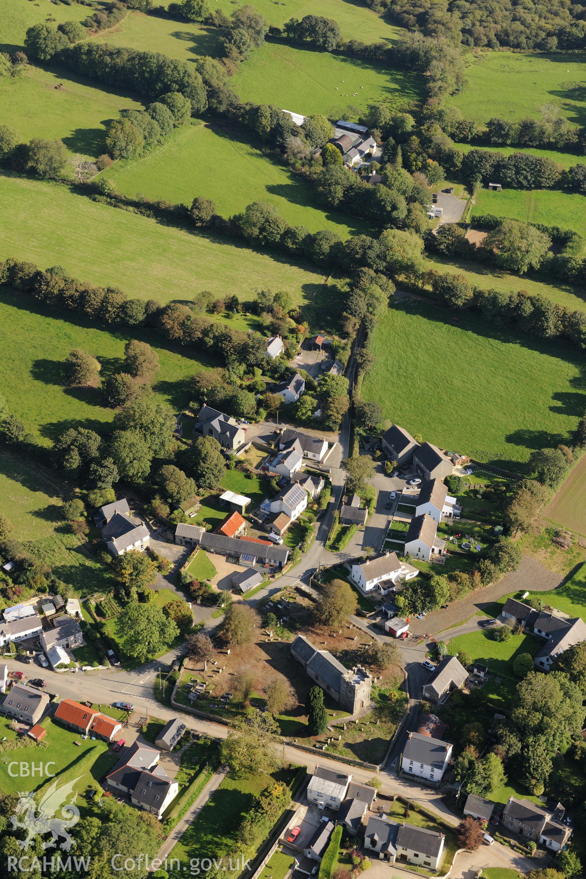 St. Mary's church in the village of Ambleston, Pembrokeshire. Oblique aerial photograph taken during the Royal Commission's programme of archaeological aerial reconnaissance by Toby Driver on 30th September 2015.