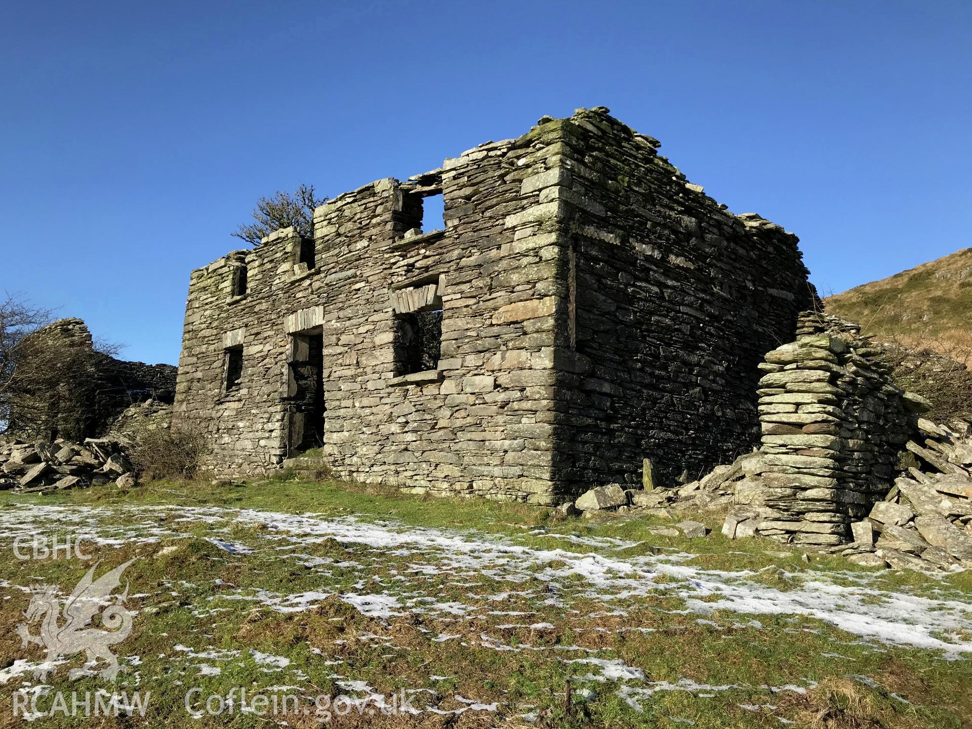 Detailed view showing exterior front elevation of deserted, roofless, dry-stone walled Ty-Canol house at Ty-Canol farmstead, Creigen Ddu. Colour photograph taken by Paul R. Davis on 17th January 2019.
