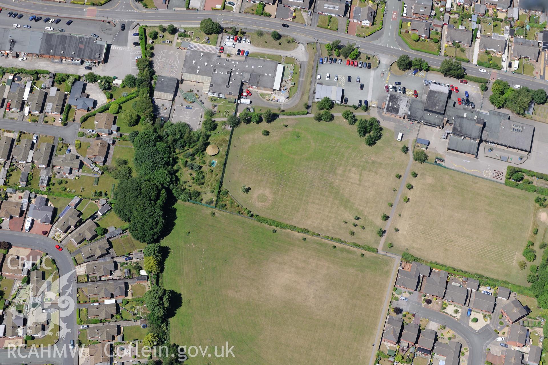 Borras Park community primary school, Wrexham. Oblique aerial photograph taken during the Royal Commission's programme of archaeological aerial reconnaissance by Toby Driver on 30th June 2015.