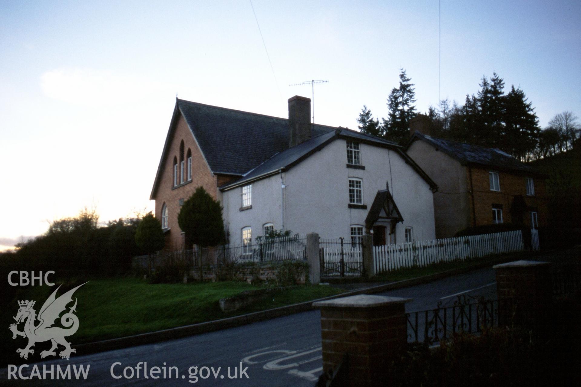 Exterior, SE gable entry, & adjoining house, from NE