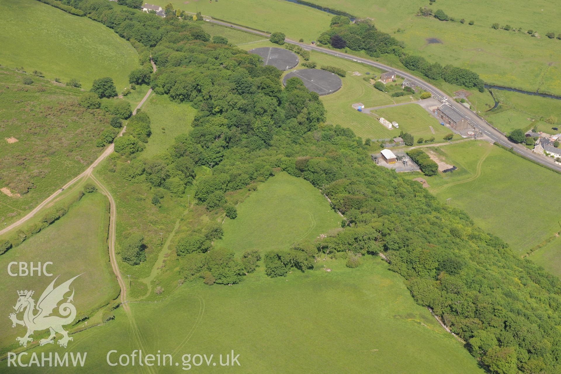 Fleming's Down promontory fort and Schwyll Pumping Station. Oblique aerial photograph taken during the Royal Commission's programme of archaeological aerial reconnaissance by Toby Driver on 19th June 2015.