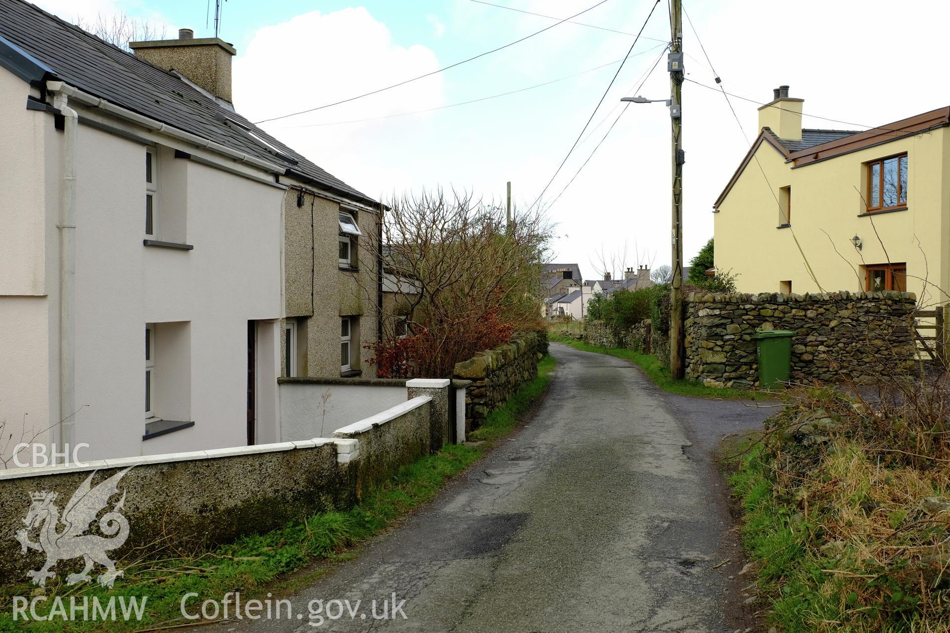 Colour photograph showing view looking south east at Min Afon and line of the Dinorwic Railway, Clwt-y-bont, Deiniolen, produced by Richard Hayman 2nd February 2017