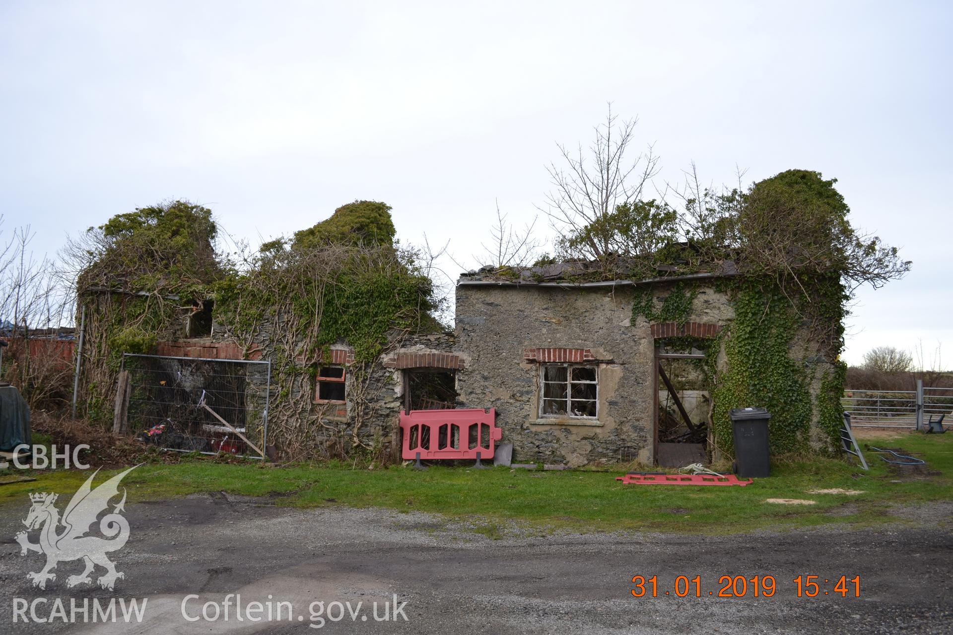 Digital colour photograph showing southern exterior elevation of Fron Deg, Caergeiliog, Ynys Mon. Produced by Gerwyn Williams to meet a condition attached to a planning application, 2019.