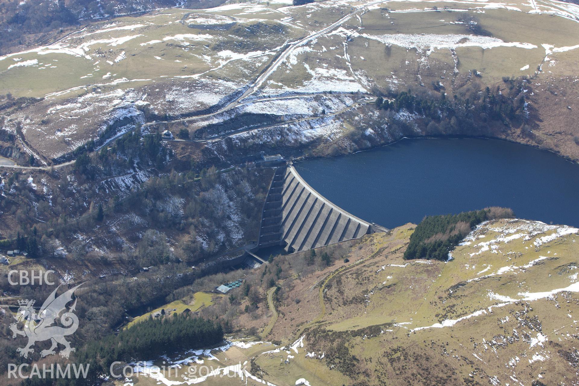 Llyn Clywedog reservoir and damn, north west of Llanidloes. Oblique aerial photograph taken during the Royal Commission?s programme of archaeological aerial reconnaissance by Toby Driver on 2nd April 2015.