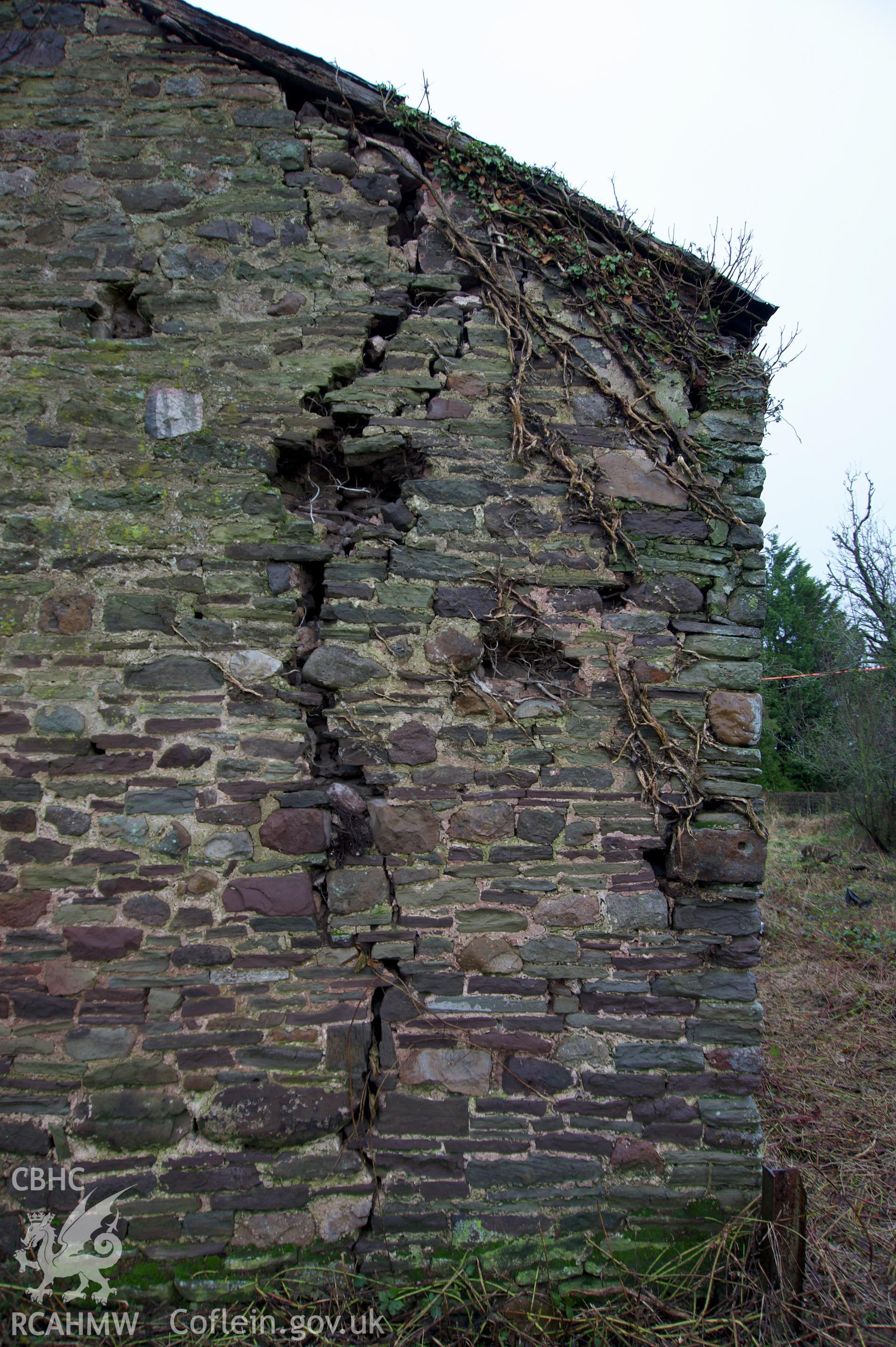 Crack towards the south side of the west gable end at Middle Ton Threshing Barn. Photographed for the Historic Building Photographic Record of Middle Ton Threshing Barn, Llanvapley, by Dan Courtney of Cog Architects, 2019.