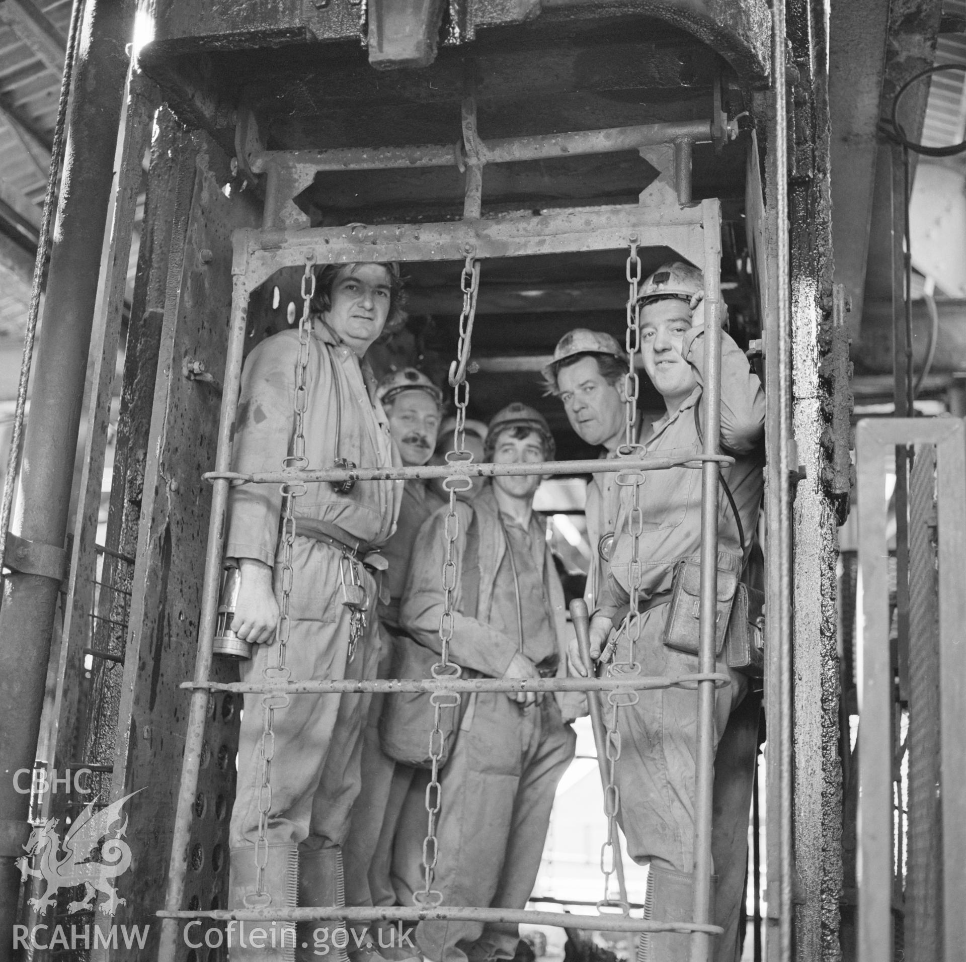 Digital copy of an acetate negative showing colliers in lift cage at Taff Colliery, from the John Cornwell Collection.