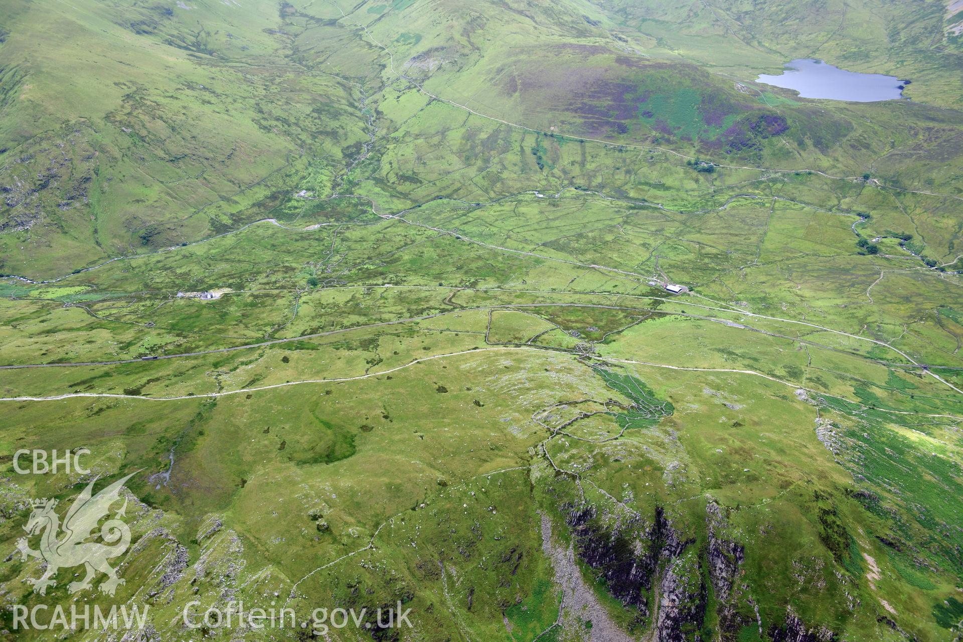 View overlooking Llyn Dwythwch Lake on Snowdon. Oblique aerial photograph taken during the Royal Commission's programme of archaeological aerial reconnaissance by Toby Driver on 30th July 2015.