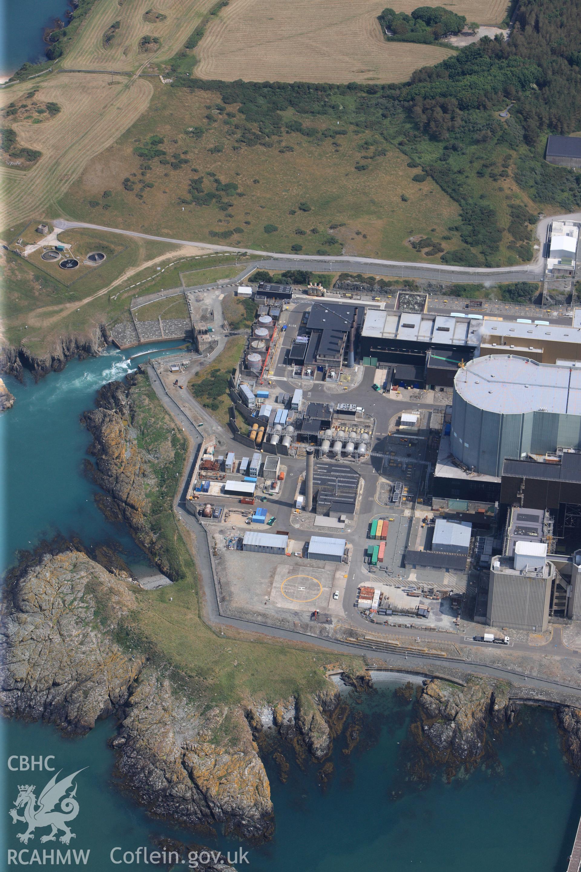 Wylfa Nuclear Power Station, near Cemmaes, on the north Anglesey coast. Oblique aerial photograph taken during the Royal Commission?s programme of archaeological aerial reconnaissance by Toby Driver on 12th July 2013.