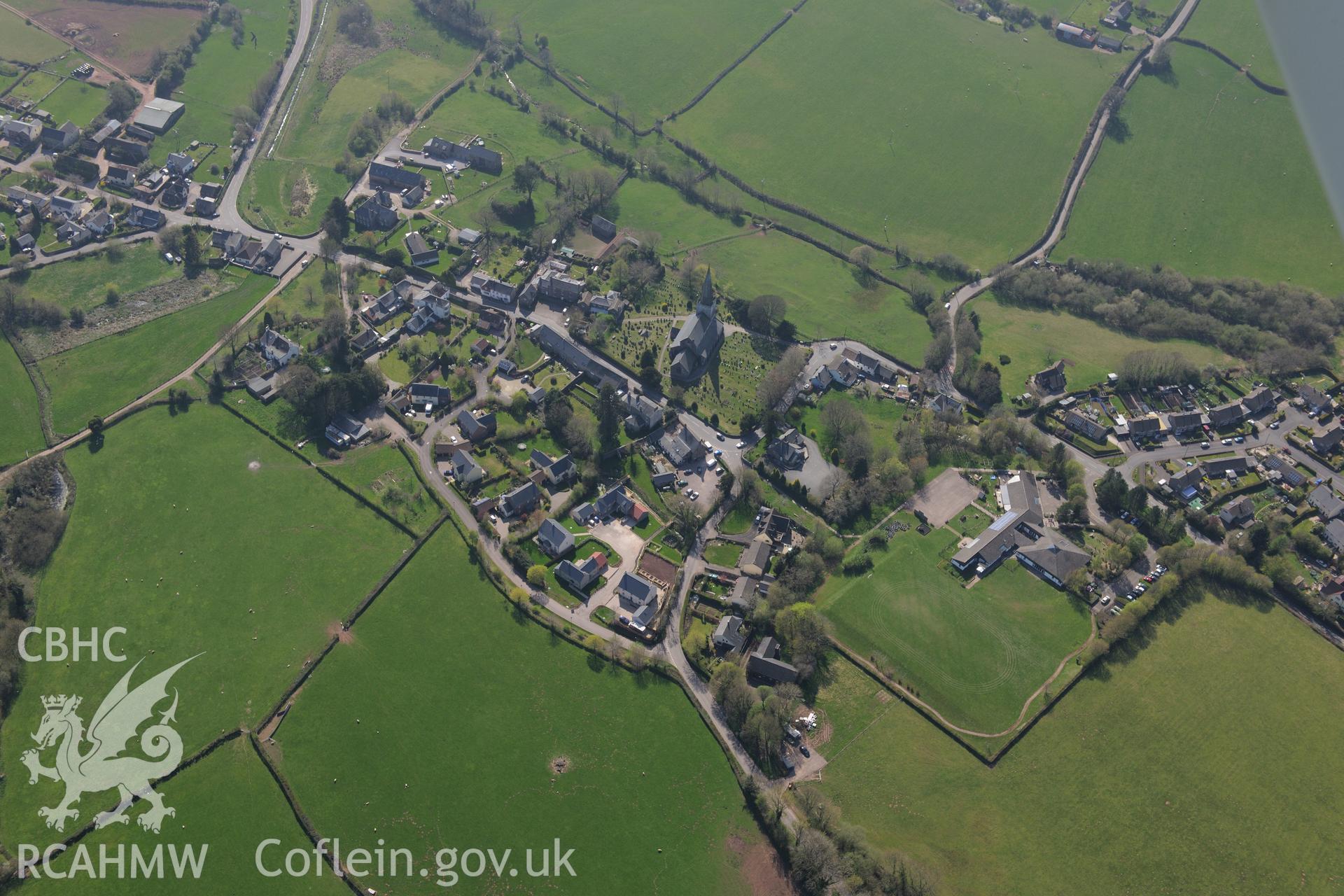 Trellech village and medieval borough including St. Nicholas' Church; medieval houses sites west of the Church; Methodist Church; Court Farm; Tump Terret; Trellech motte; village earthworks and virtuous well. Oblique aerial photograph taken during the Royal Commission's programme of archaeological aerial reconnaissance by Toby Driver on 21st April 2015.