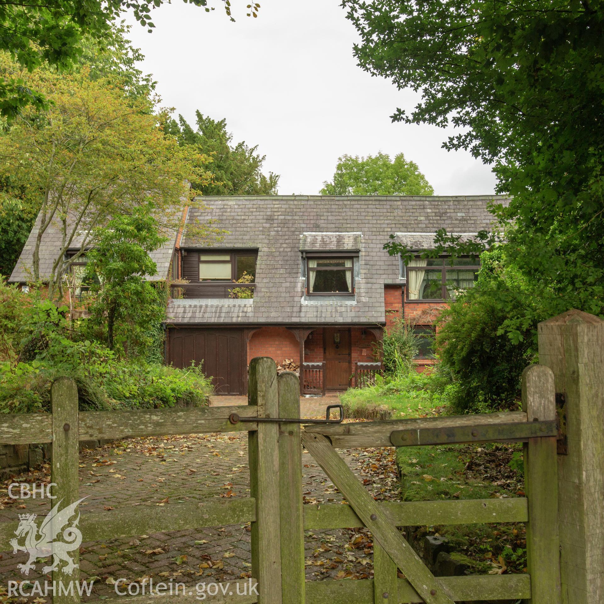 Colour photograph showing side elevation and entrance of former Pentrebeirdd Independent Chapel, later converted into two houses. Photographed by Richard Barrett on 9th September 2018.