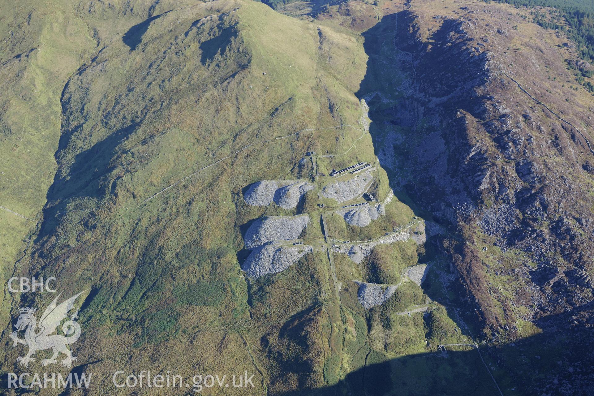 Workshop and barracks at Prince of Wales slate mine, near Beddgelert. Oblique aerial photograph taken during the Royal Commission's programme of archaeological aerial reconnaissance by Toby Driver on 2nd October 2015.