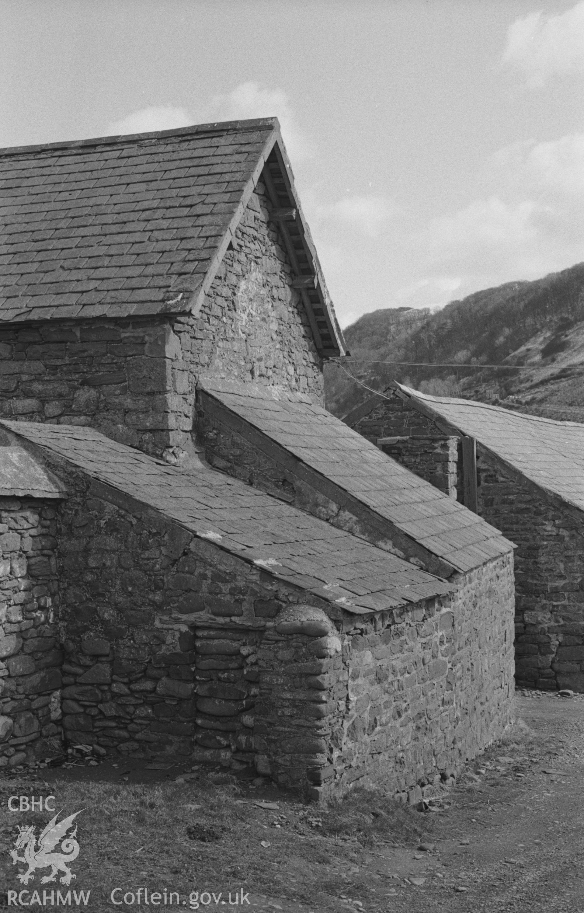 Digital copy of a black and white negative showing outhouses at seaward side of Glan-y-Mor farm near Clarach beach. Photographed by Arthur O. Chater on 2nd April 1968 looking south east from Grid Reference SN 586 841.