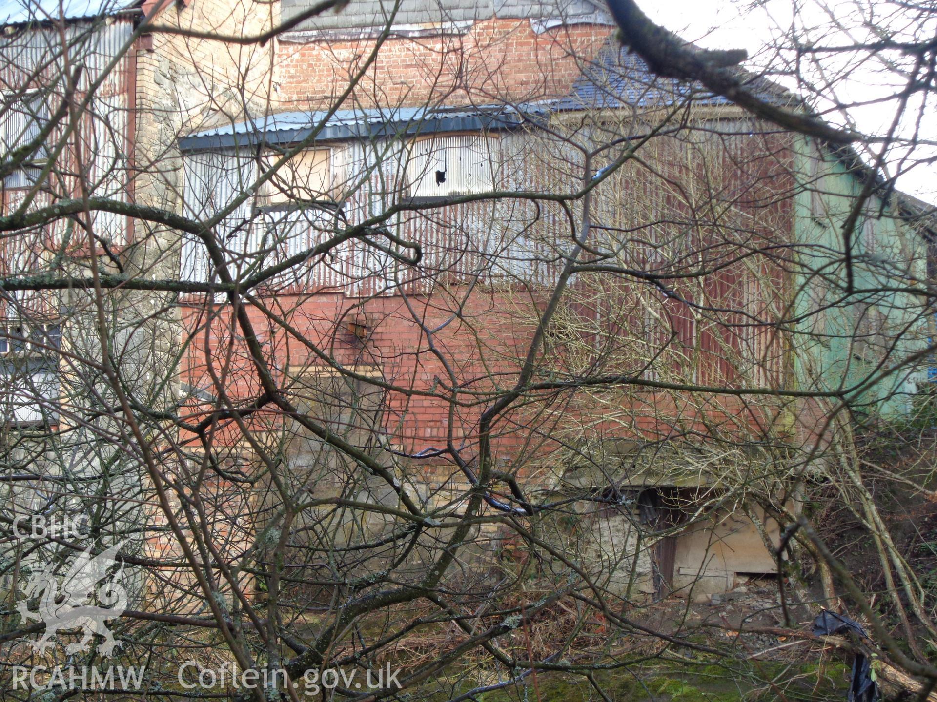 Detail of riverside elevation. Looking north east. Photographed as part of archaeological building survey of The Old Sawmill, Llanidloes, Powys, conducted by Archaeology Wales, 2018. Project no. 2583. Report no. 1645.