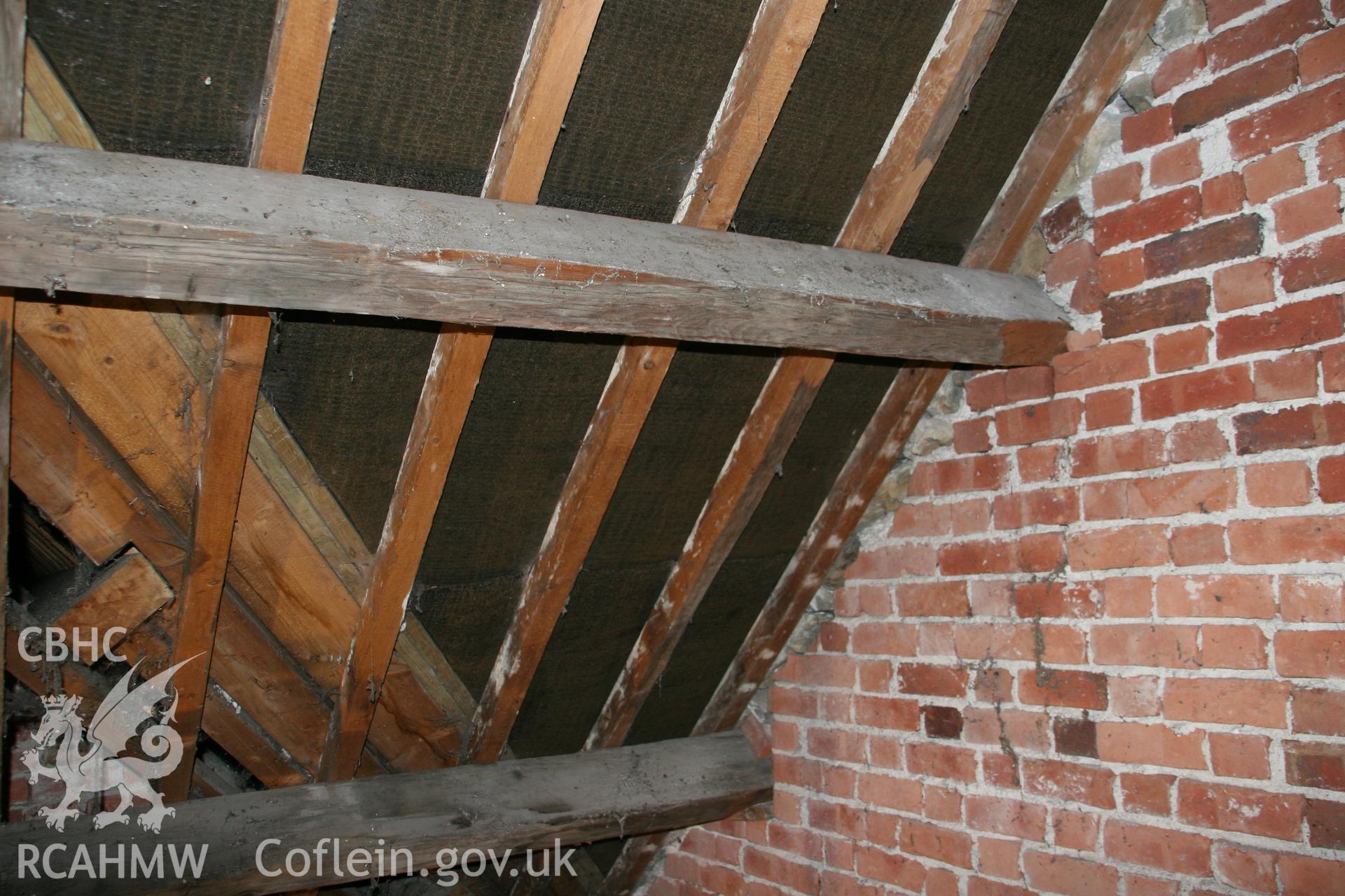 Photograph showing detailed interior view of brick wall, wooden beams and roof of former Llawrybettws Welsh Calvinistic Methodist chapel, Glanyrafon, Corwen. Produced by Tim Allen on 27th February 2019 to meet a condition attached to planning application.