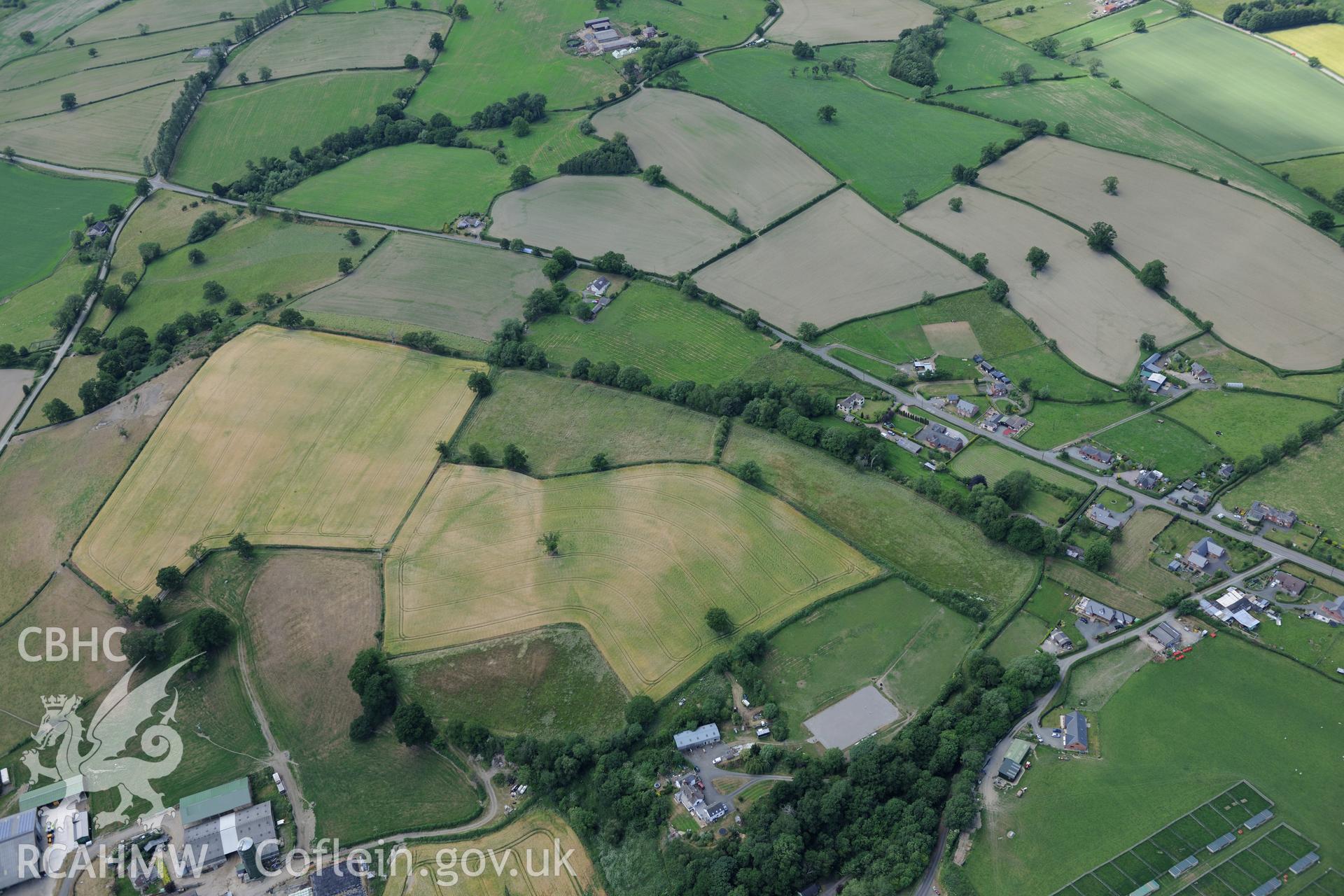 Section of Offa's Dyke from Cwm by-road to Hem road, north of Montgomery. Oblique aerial photograph taken during the Royal Commission's programme of archaeological aerial reconnaissance by Toby Driver on 30th June 2015.