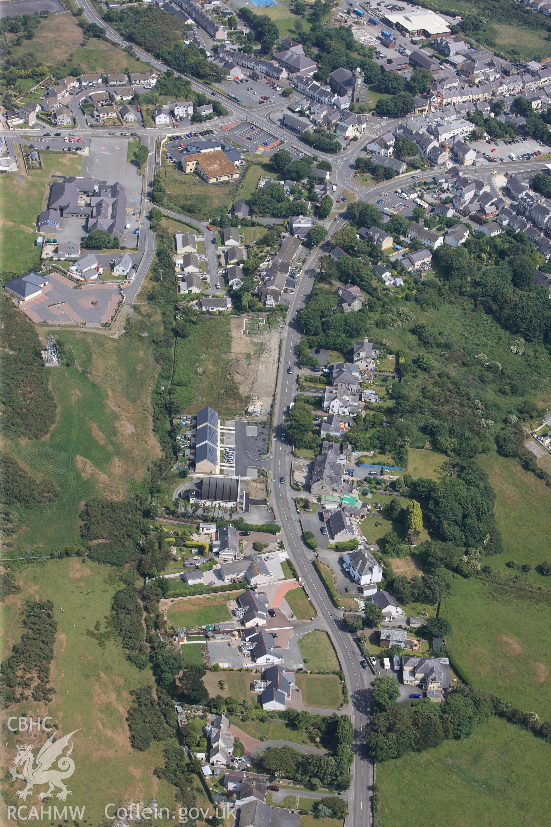 The village of Amlwch on Anglesey. Oblique aerial photograph taken during the Royal Commission?s programme of archaeological aerial reconnaissance by Toby Driver on 12th July 2013.