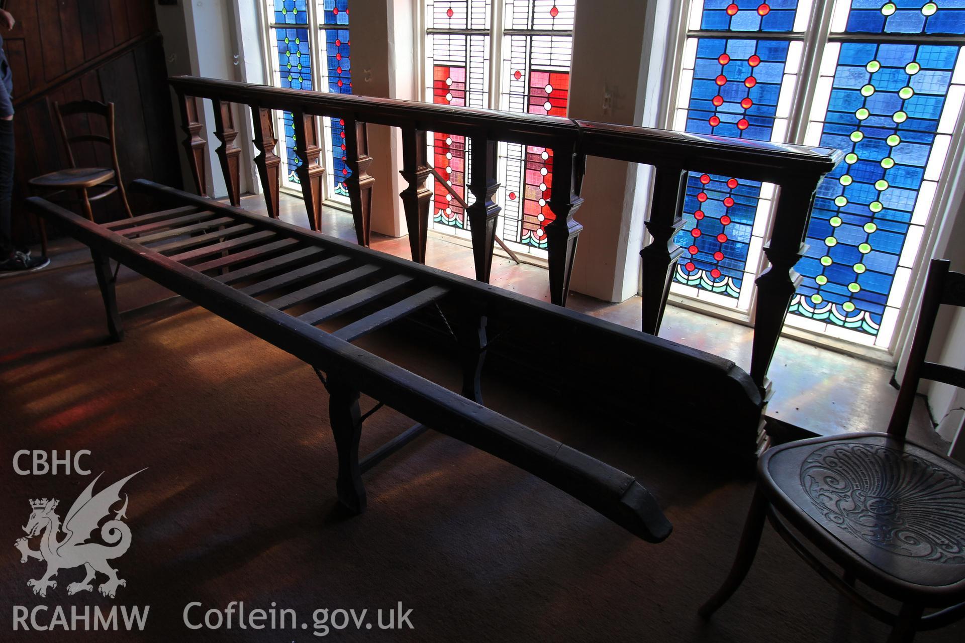 Interior view of stained glass windows and wooden seating. Photographic survey of Seion Welsh Baptist Chapel, Morriston, conducted by Sue Fielding on 13th May 2017.