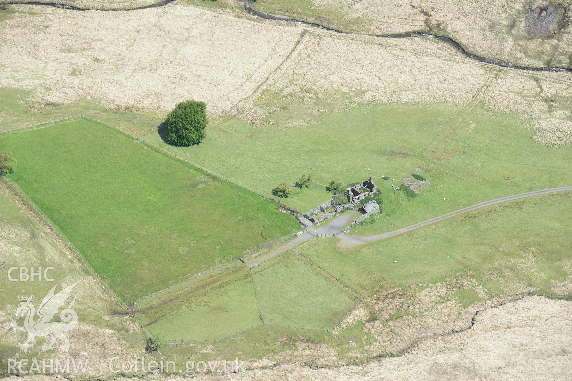 Lluest Aber Farmstead including the house(s), garden, barn and byer. Oblique aerial photograph taken during the Royal Commission's programme of archaeological aerial reconnaissance by Toby Driver on 3rd June 2018.