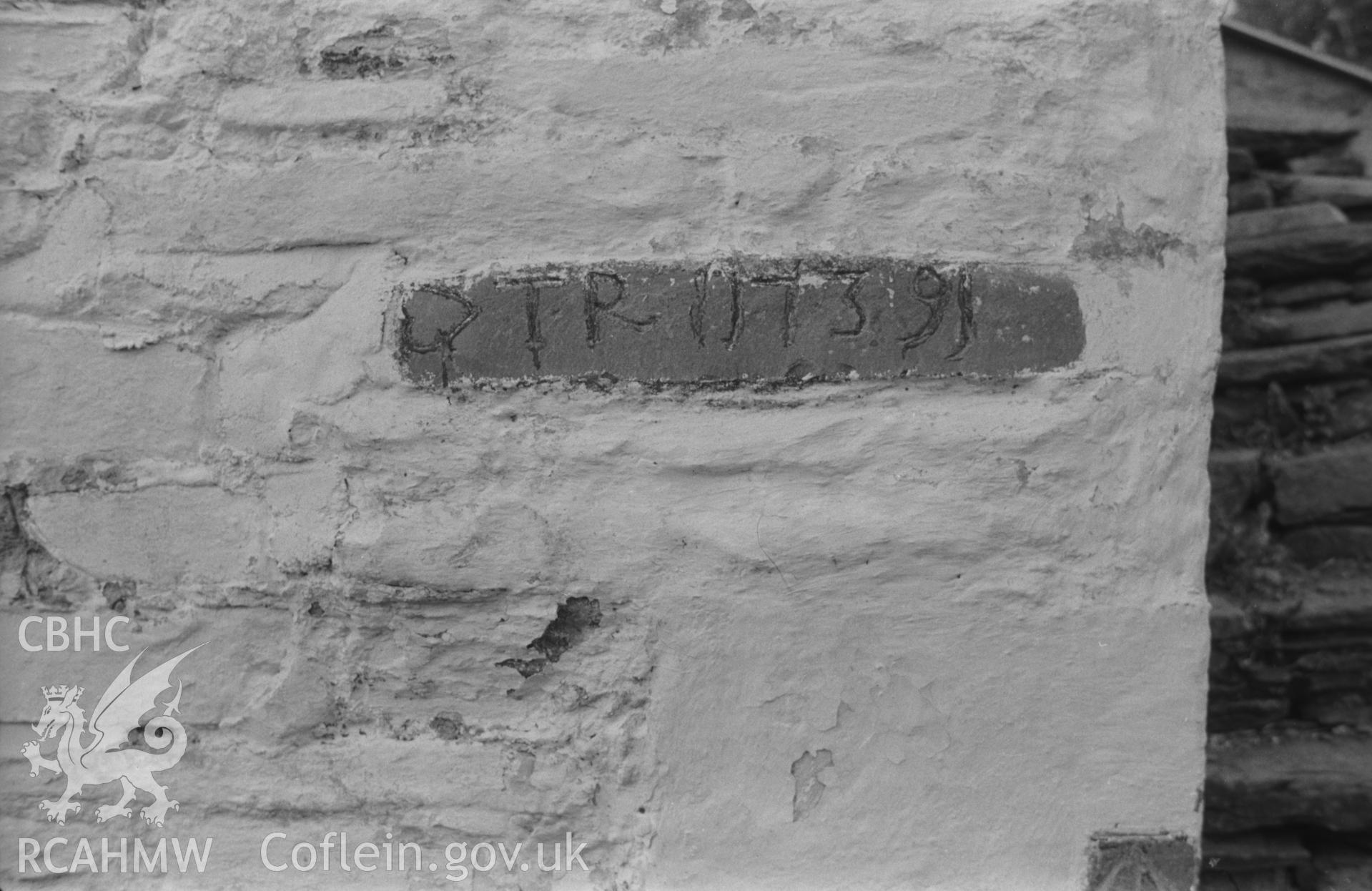 Digital copy of a black and white negative showing inscribed date stone (1739) in wall of outhouse at Lletty-Meurig, Tregaron, on the road to Cwm Berwyn. Photographed by Arthur O. Chater in 2nd September 1966 from Grid Reference SN 693 593.