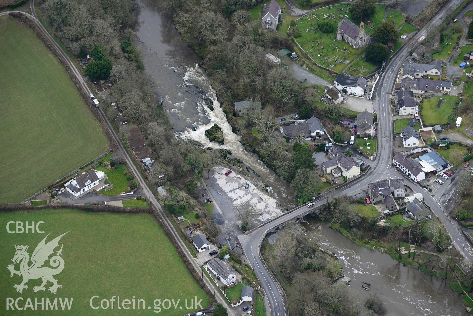 St. Llawddog's church and Cenarth bridge, Cenarth. Oblique aerial photograph taken during the Royal Commission's programme of archaeological aerial reconnaissance by Toby Driver on 13th March 2015.