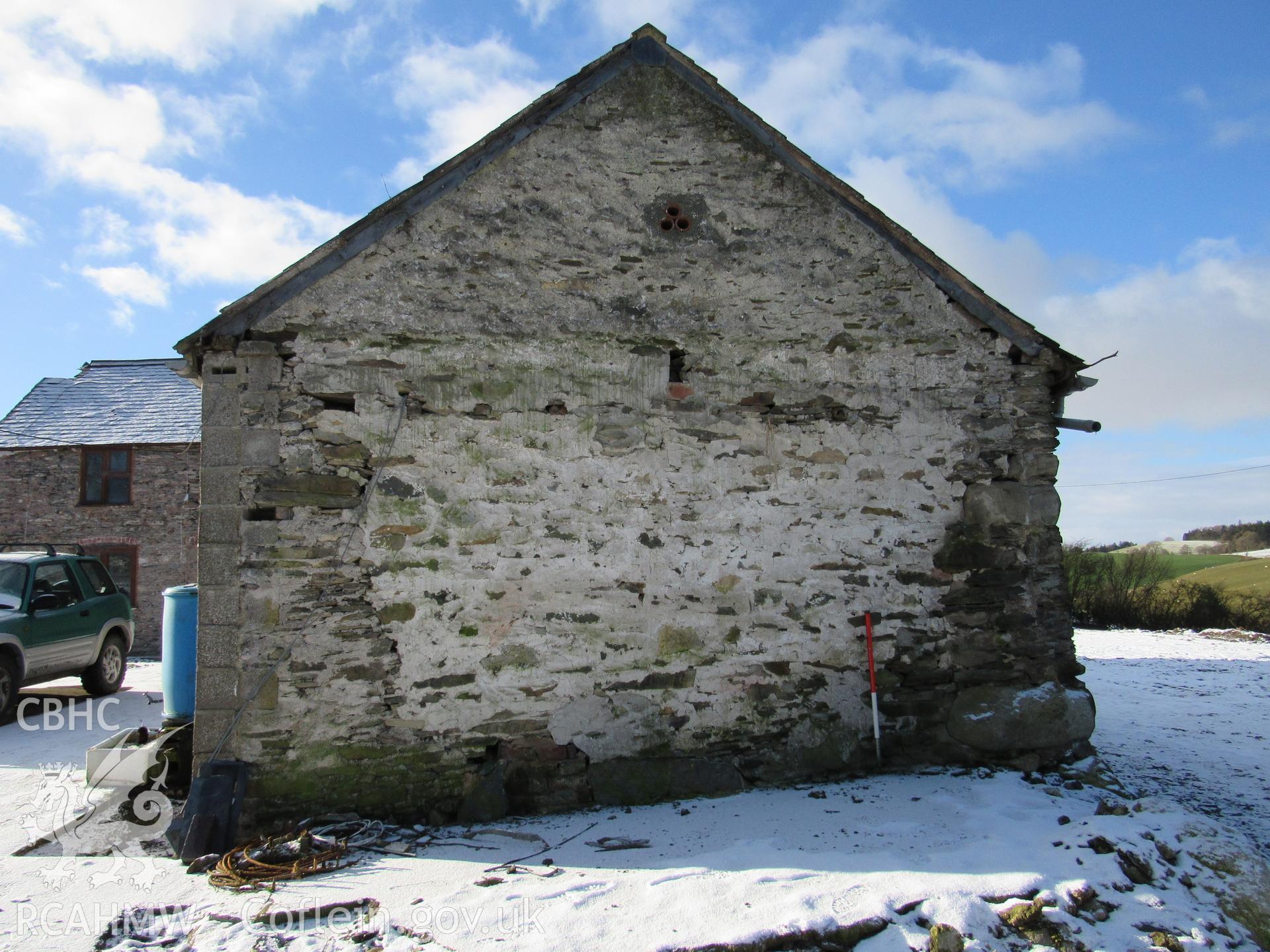 The barn north-east elevation gable end, view south-west. 1m scale. Photographed as part of archaeological building recording conducted at Bryn Ysguboriau, Llanelidan, Denbighshire, carried out by Archaeology Wales, 2018. Project no. P2587.