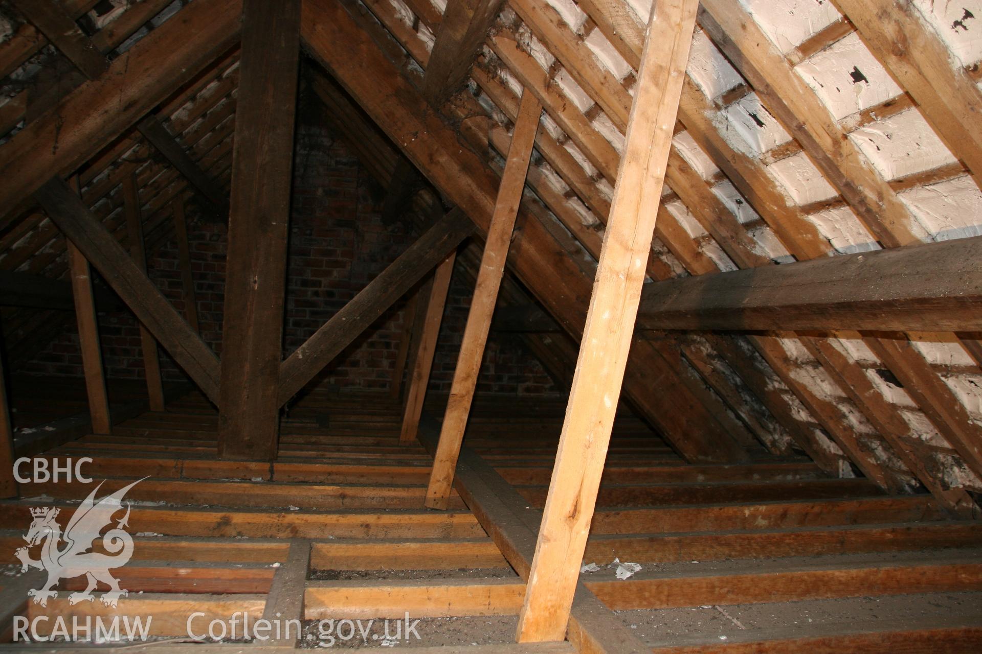 Photograph showing detailed interior view of brick wall, wooden beams and roof of former Llawrybettws Welsh Calvinistic Methodist chapel, Glanyrafon, Corwen. Produced by Tim Allen on 27th February 2019 to meet a condition attached to planning application.