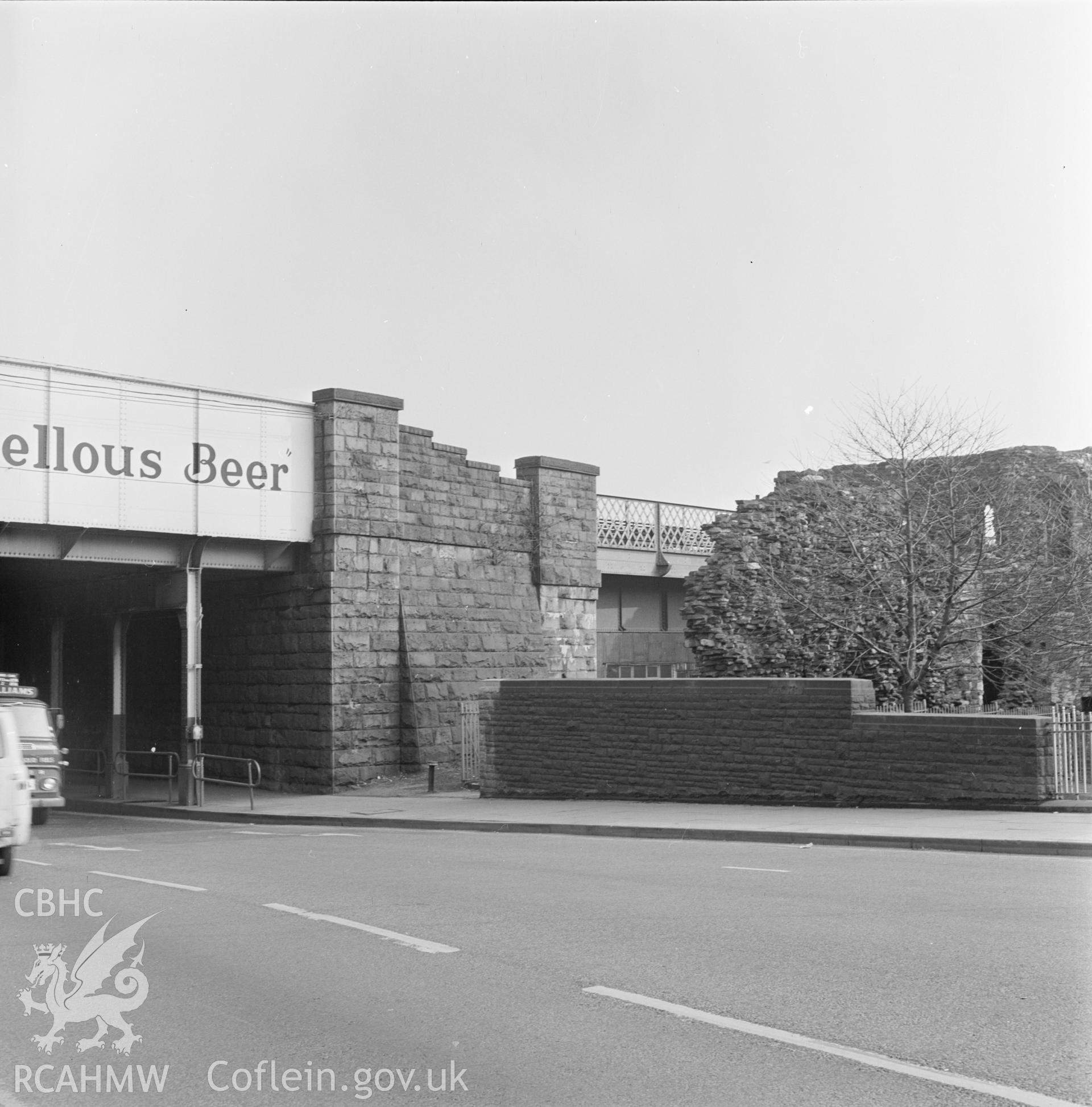 Digital copy of a black and white negative showing Newport Castle, view of "railway bridge and spur wall to be demolished from SW", 27th March 1969.