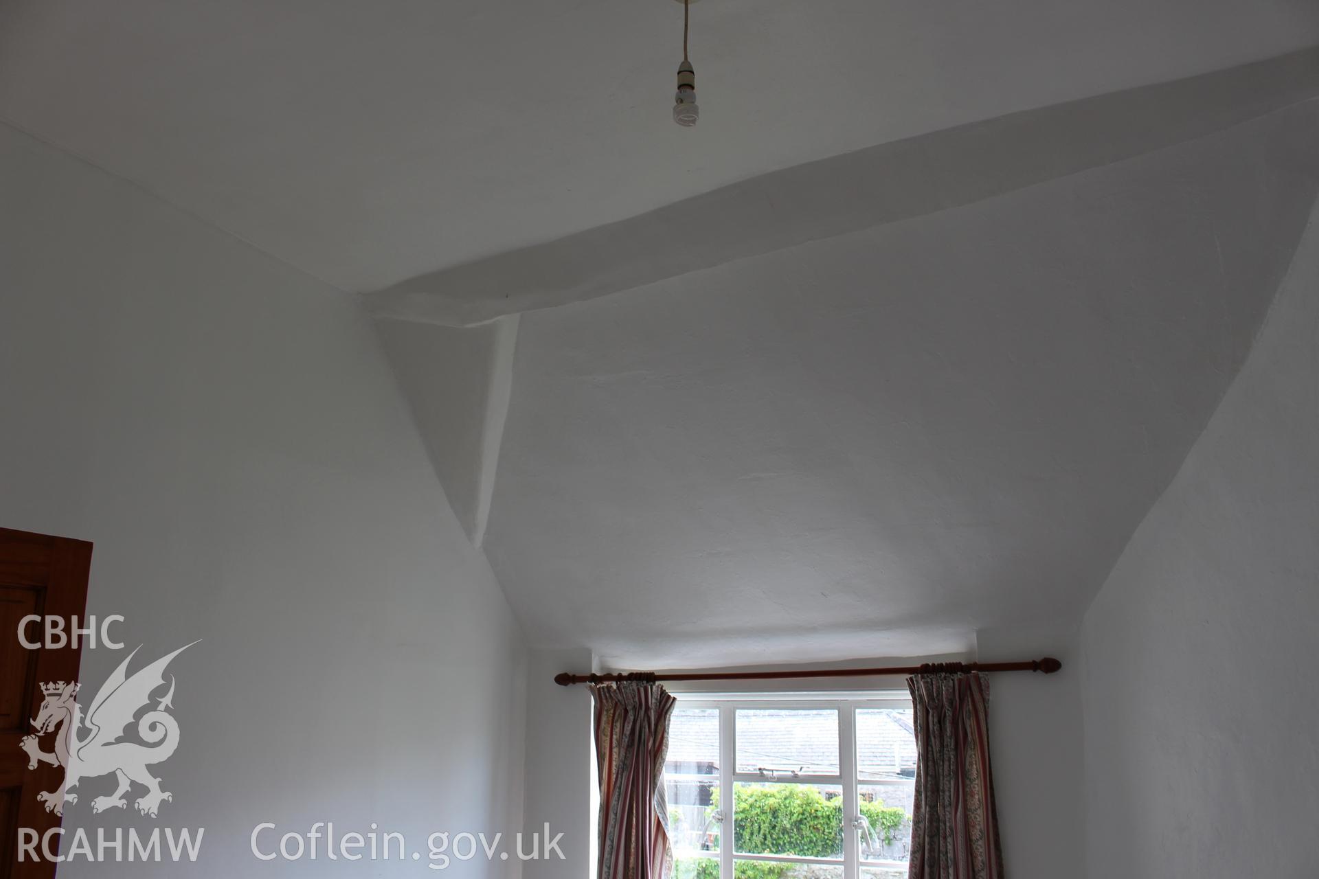 Colour photograph showing interior room with sloping ceiling at 5-7 Mwrog Street, Ruthin. Photographed during survey conducted by Geoff Ward on 14th May 2014.