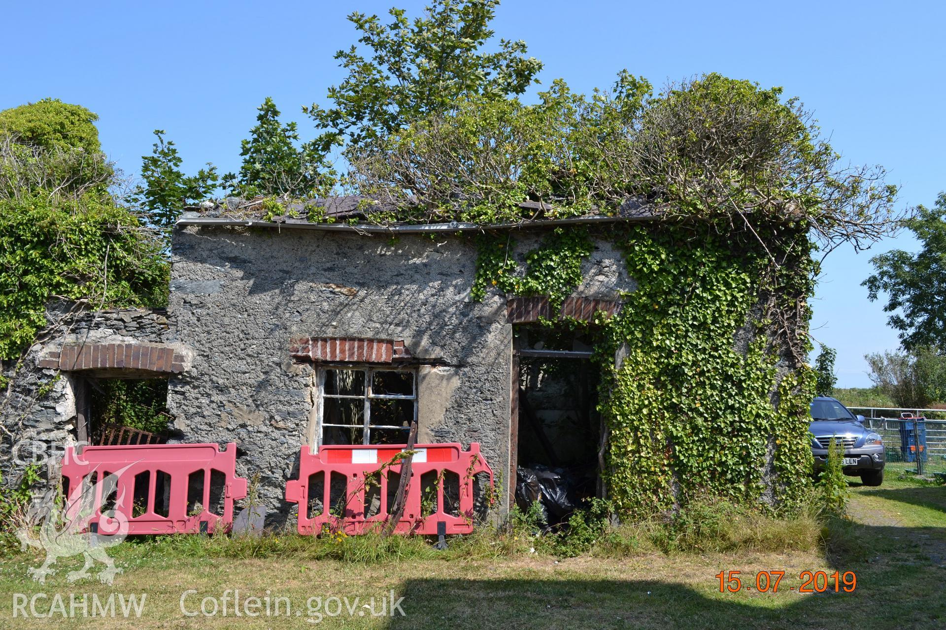 Digital colour photograph showing southern exterior elevation of the old butcher's shop at Fron Deg, Caergeiliog, Ynys Mon. Produced by Gerwyn Williams to meet a condition attached to a planning application, 2019.