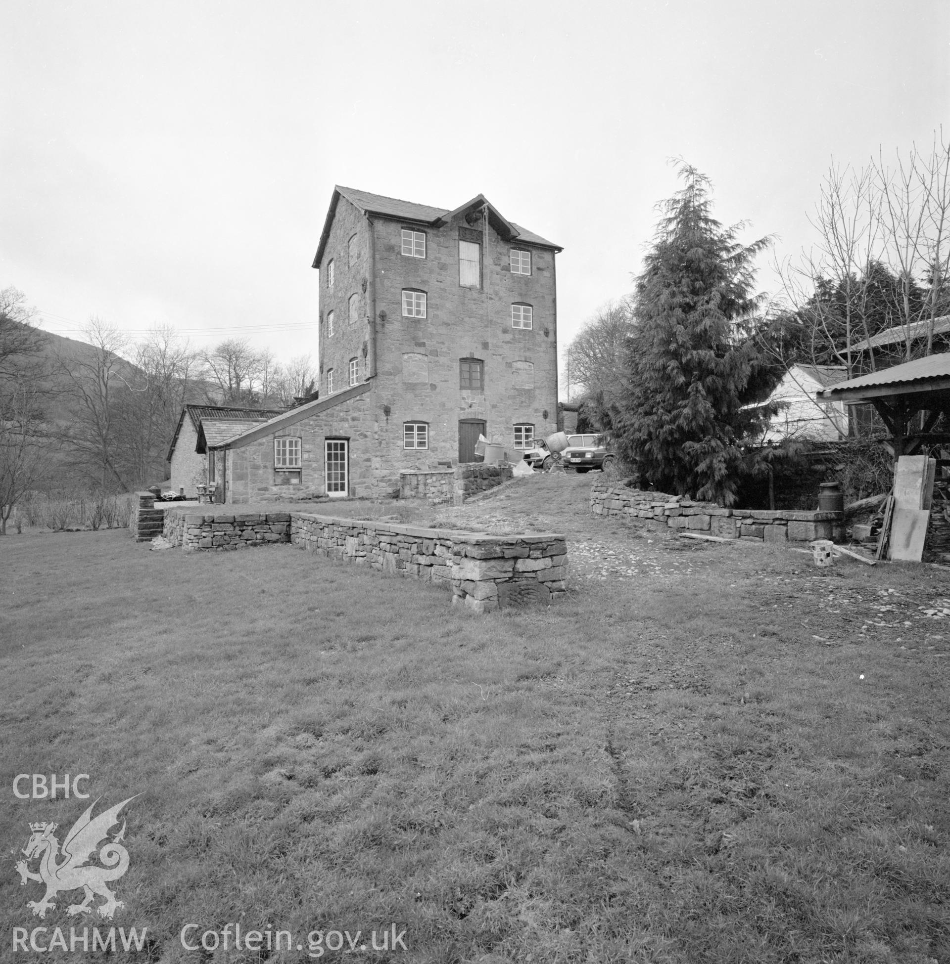Digital copy of a black and white negative showing exterior view of Trevor Old Mill taken by RCAHMW, 1987.