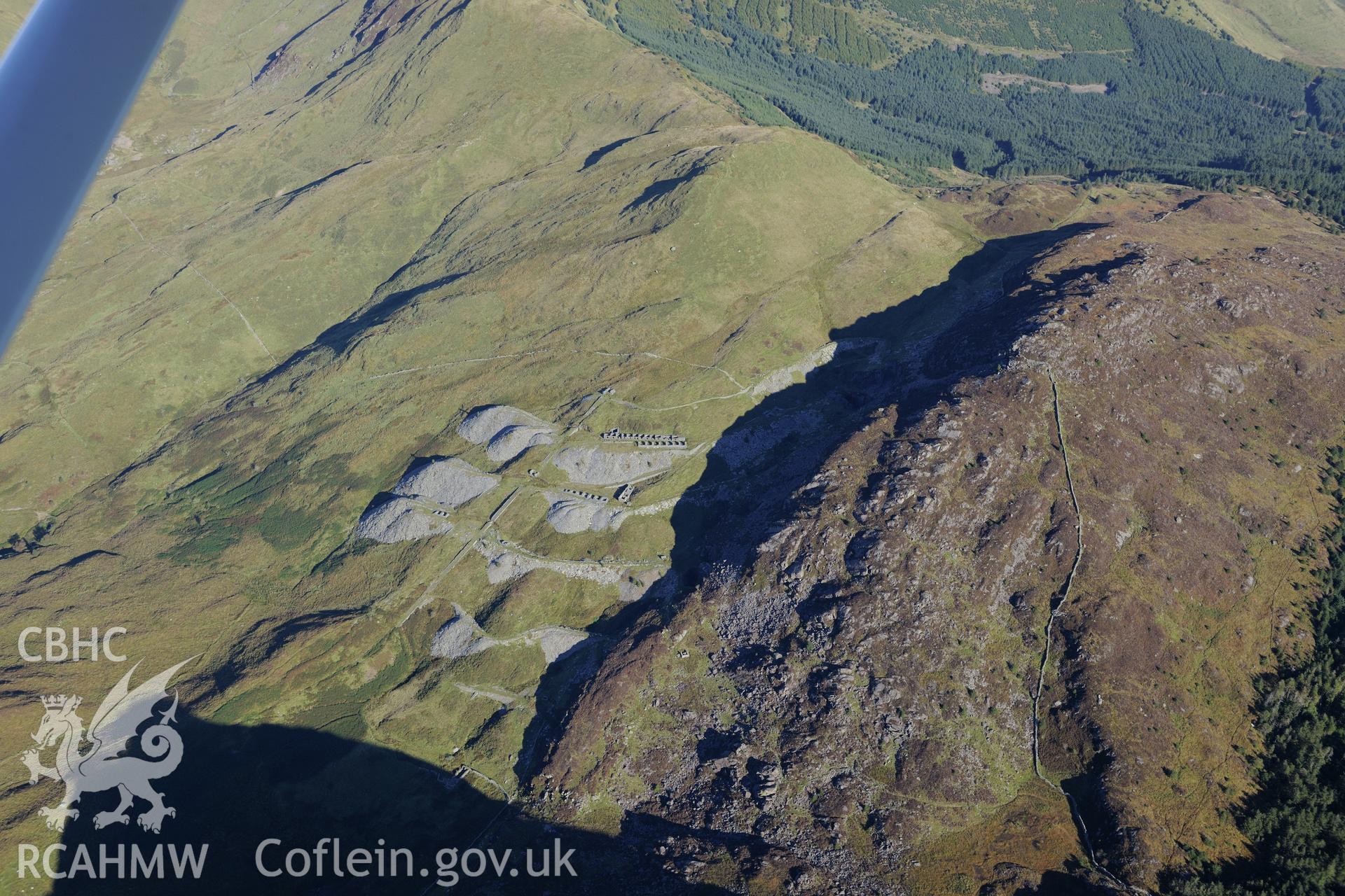 Workshop and barracks at Prince of Wales slate mine, near Beddgelert. Oblique aerial photograph taken during the Royal Commission's programme of archaeological aerial reconnaissance by Toby Driver on 2nd October 2015.
