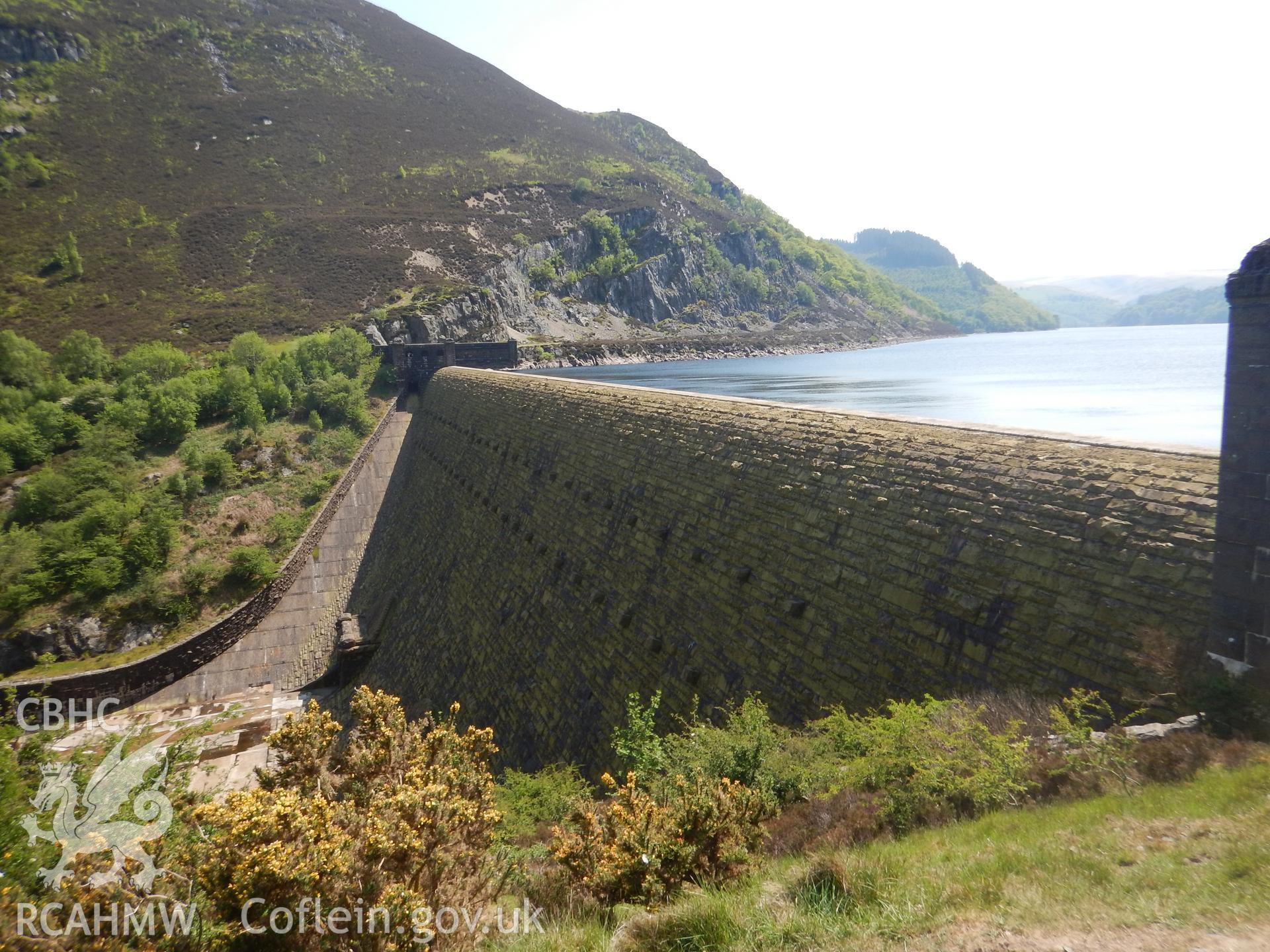 Caban Coch reservoir dam, looking south. Photographed as part of Archaeological Desk Based Assessment of Afon Claerwen, Elan Valley, Rhayader, Powys. Assessment conducted by Archaeology Wales in 2018. Report no. 1681. Project no. 2573.