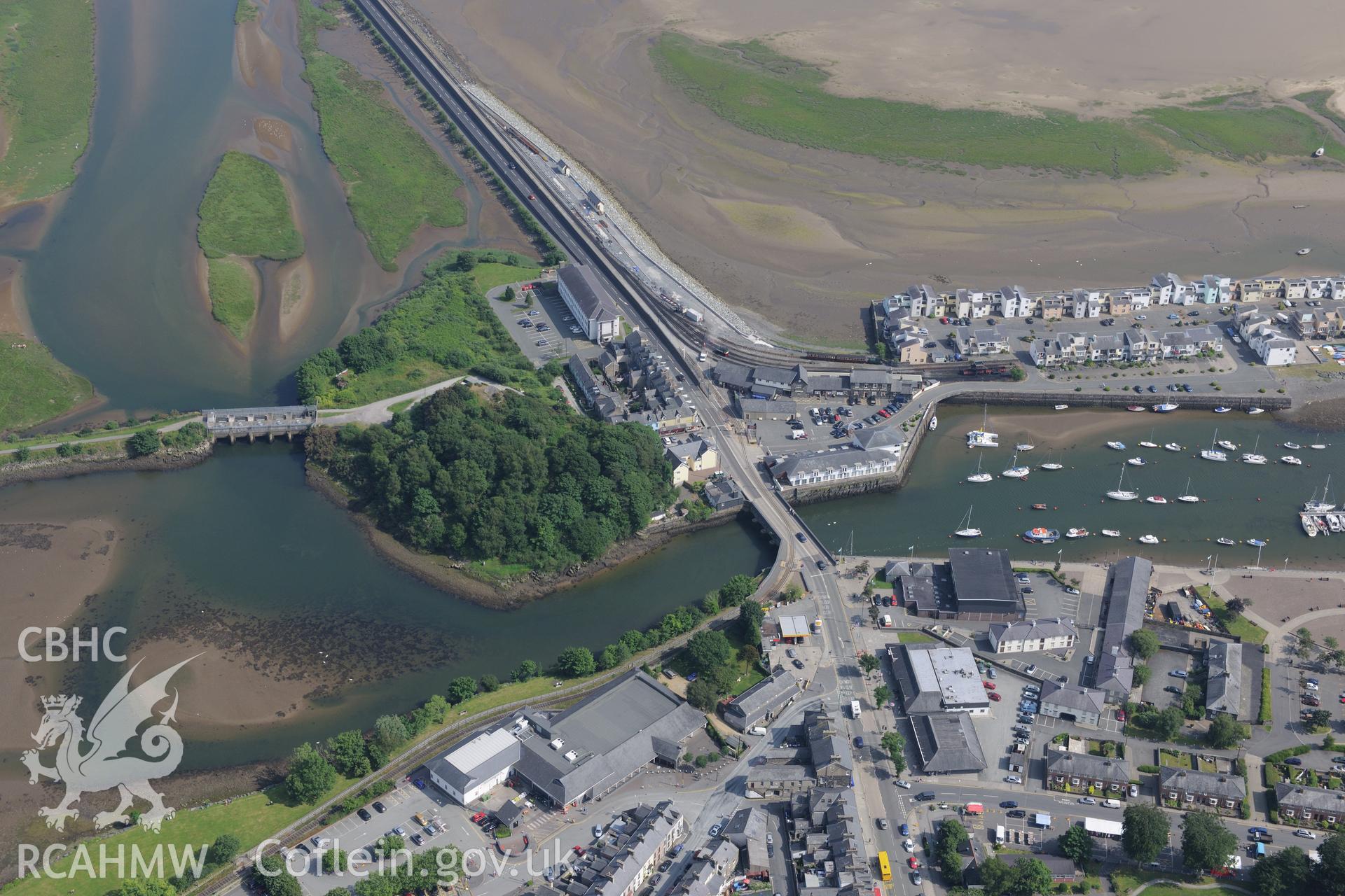 Greaves and Oakeley's wharf at Porthmadog Harbour, Porthmadog. Oblique aerial photograph taken during the Royal Commission?s programme of archaeological aerial reconnaissance by Toby Driver on 12th July 2013.